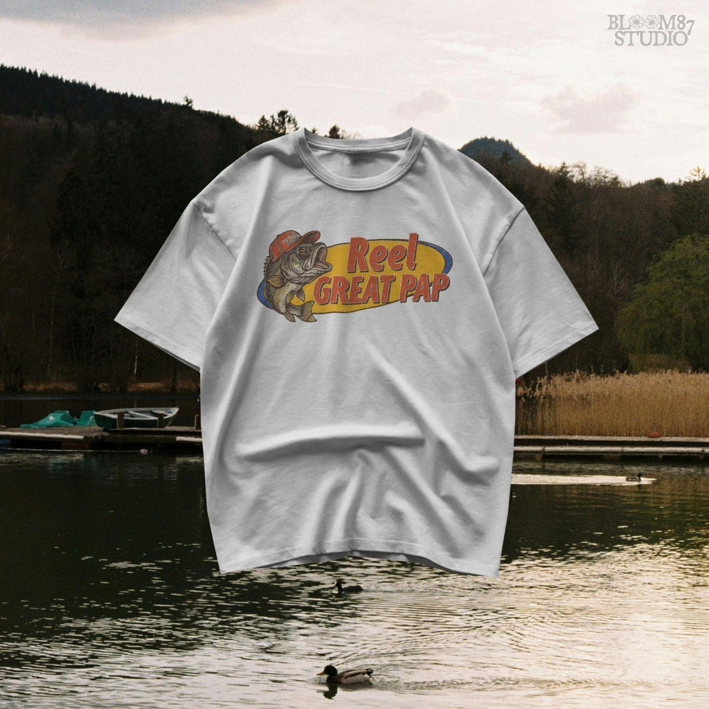 Vintage-style illustration of a largemouth bass in a red hat with retro text “Reel Great Pap” on a yellow and blue background