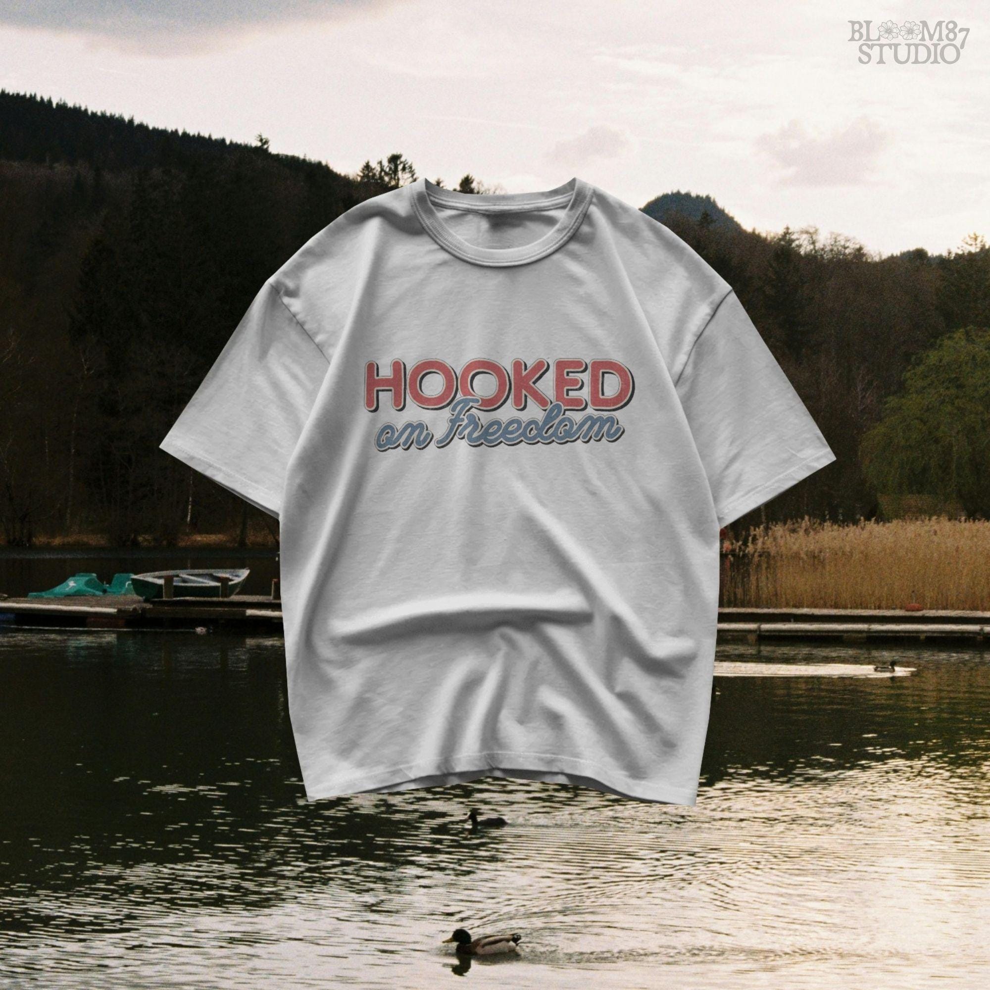 Three saltwater game fish (redfish, flounder, trout) hanging from a line, with a small American flag detail on one fish, in vintage patriotic fishing style