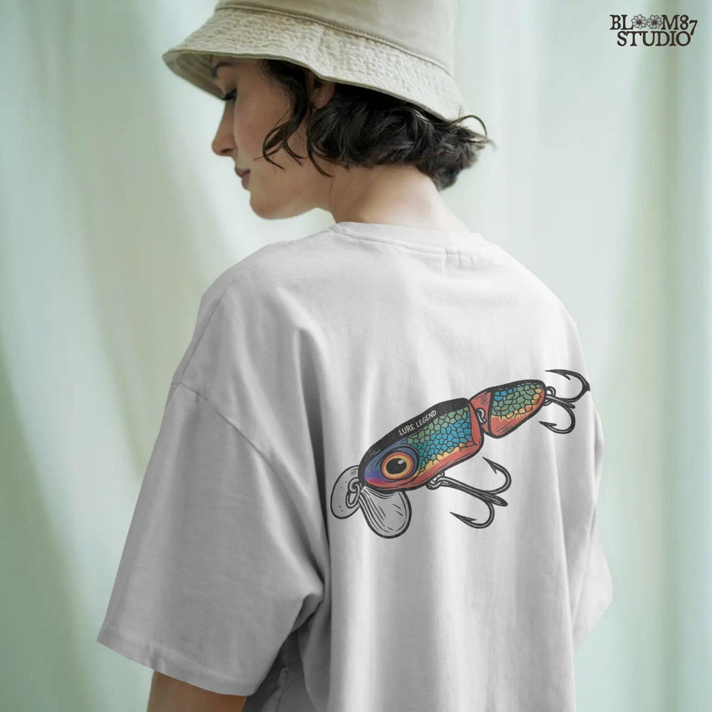 Colorful vintage fishing lure with rainbow scale pattern, metal hooks, and “Lure Legend” text – designed in bold cartoon style