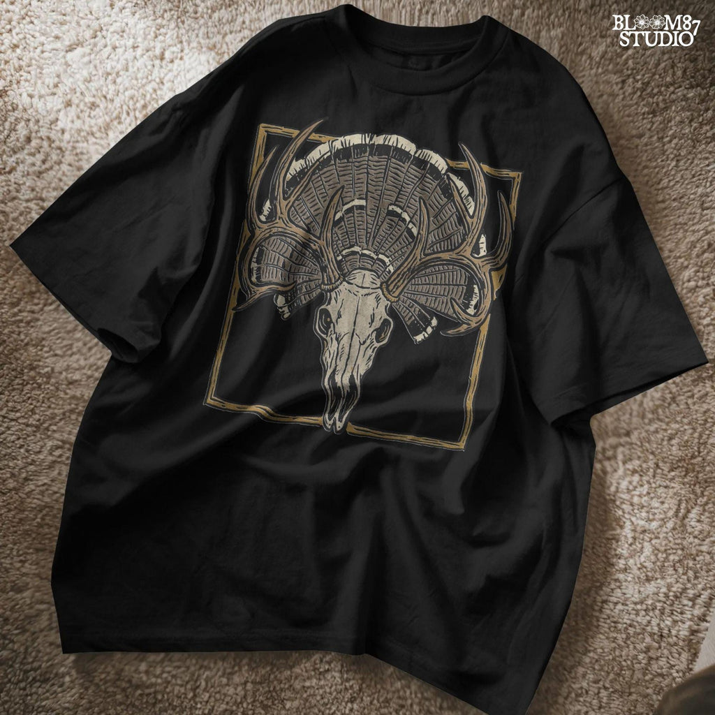 Illustration of a deer skull with antlers set in front of a fanned turkey tail and framed in a rustic square border