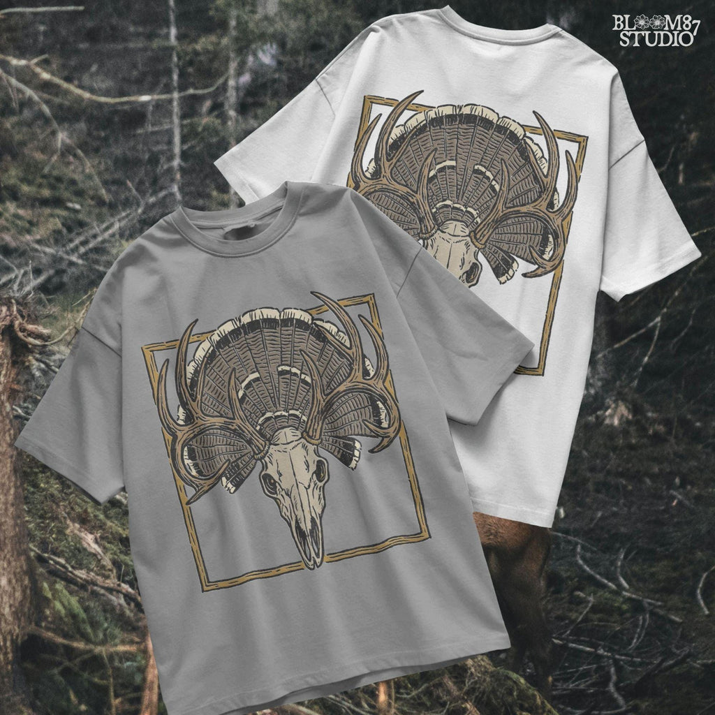 Illustration of a deer skull with antlers set in front of a fanned turkey tail and framed in a rustic square border