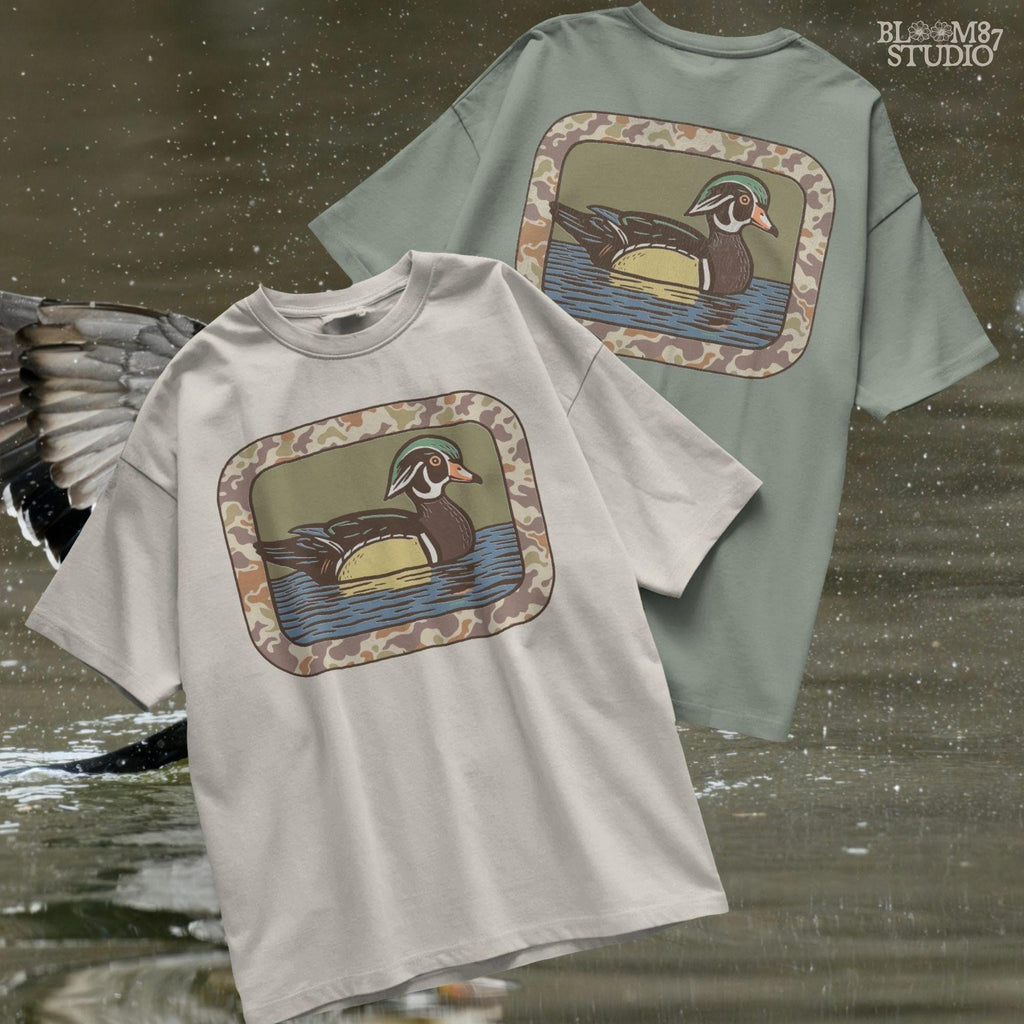 Rustic wood duck illustration with green, brown, and tan camo border; sublimation PNG for hunting or wildlife-themed crafts and apparel.
