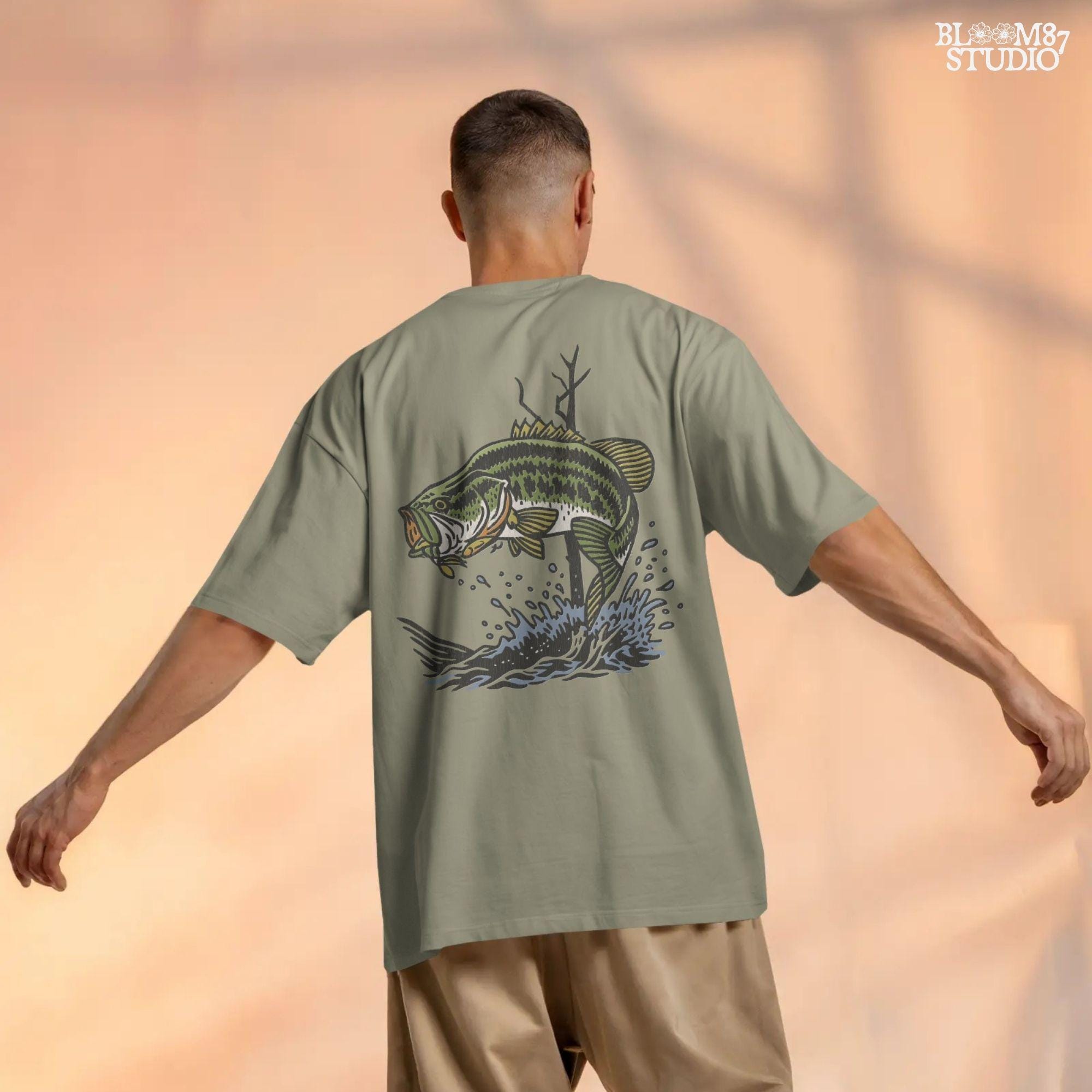 Largemouth bass fish leaping from water with a lure in its mouth, surrounded by splashing water and tree branches in a bold vintage style.