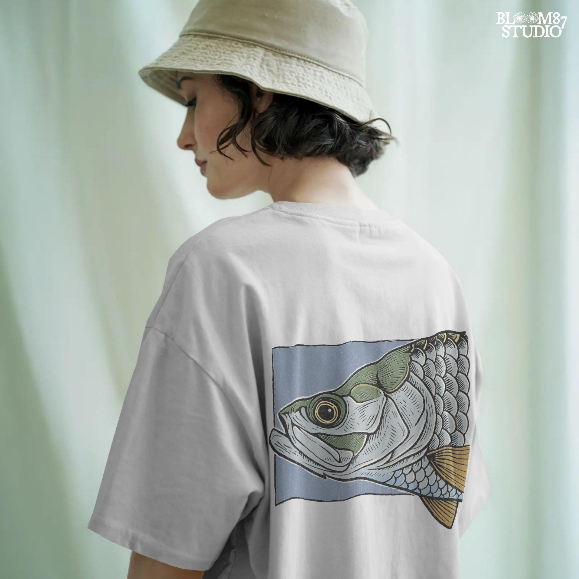 Close-up illustration of a large saltwater fish head with detailed scales, eye, fins, and vintage engraving-style shading on blue background