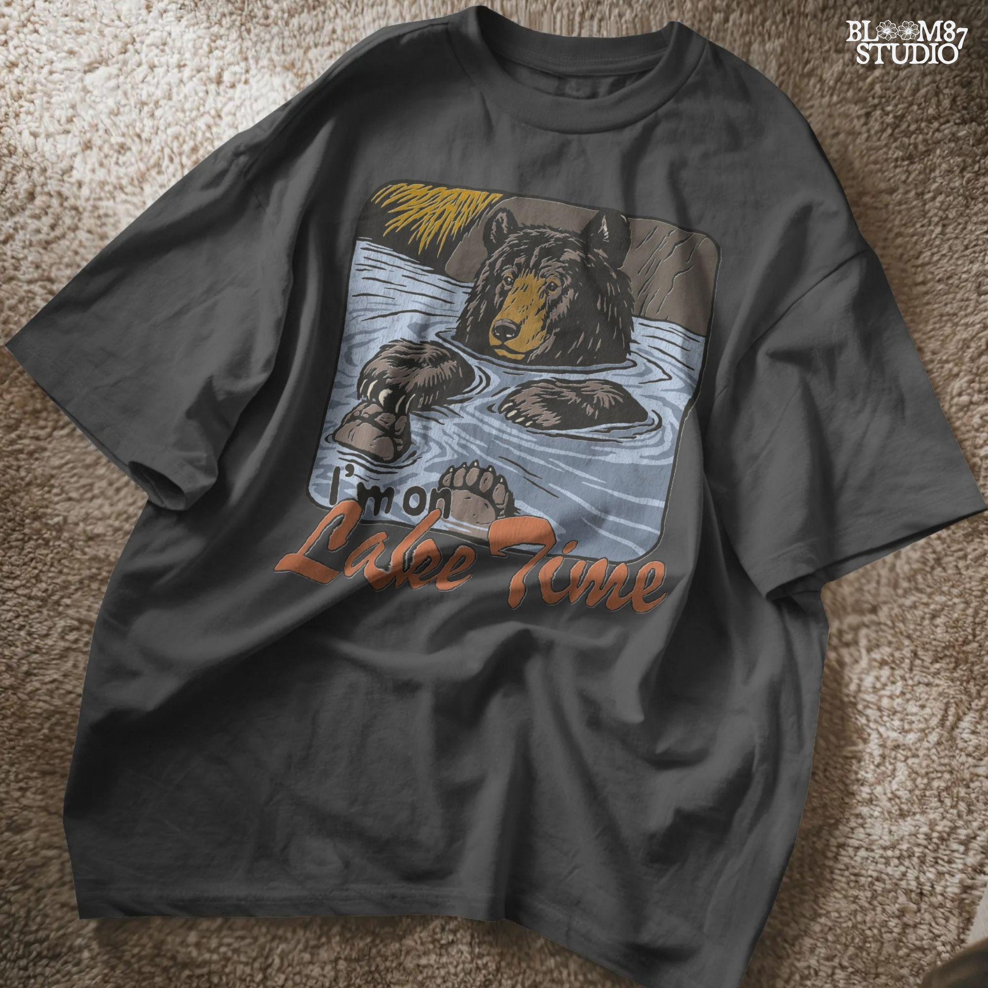 Cartoon bear relaxing in a lake with paws up, text reads “I’m on Lake Time,” in a cozy, vintage outdoor style.