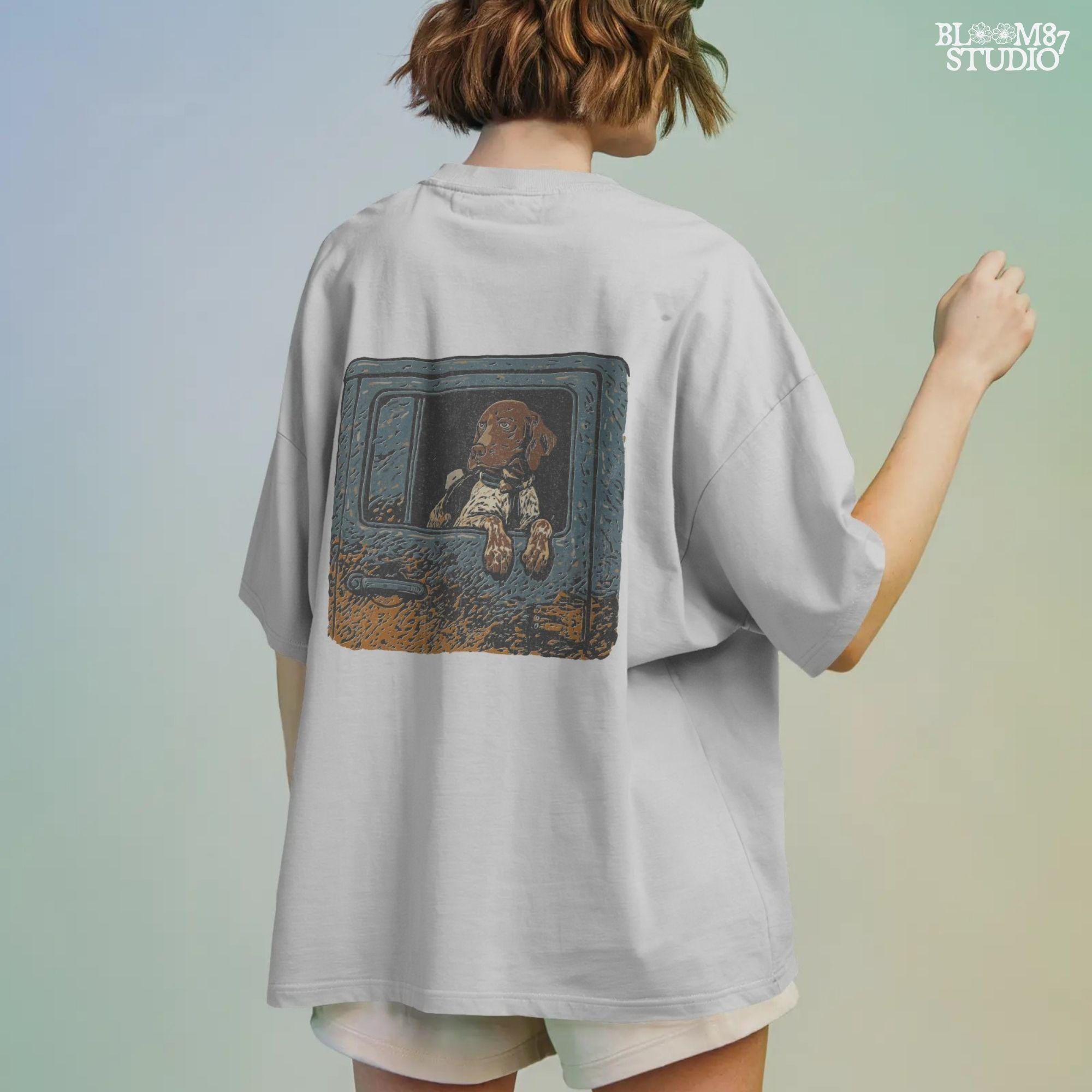 Rustic illustration of a German Shorthaired Pointer dog looking out from a muddy truck window, designed for sublimation and outdoor-themed pet decor.
