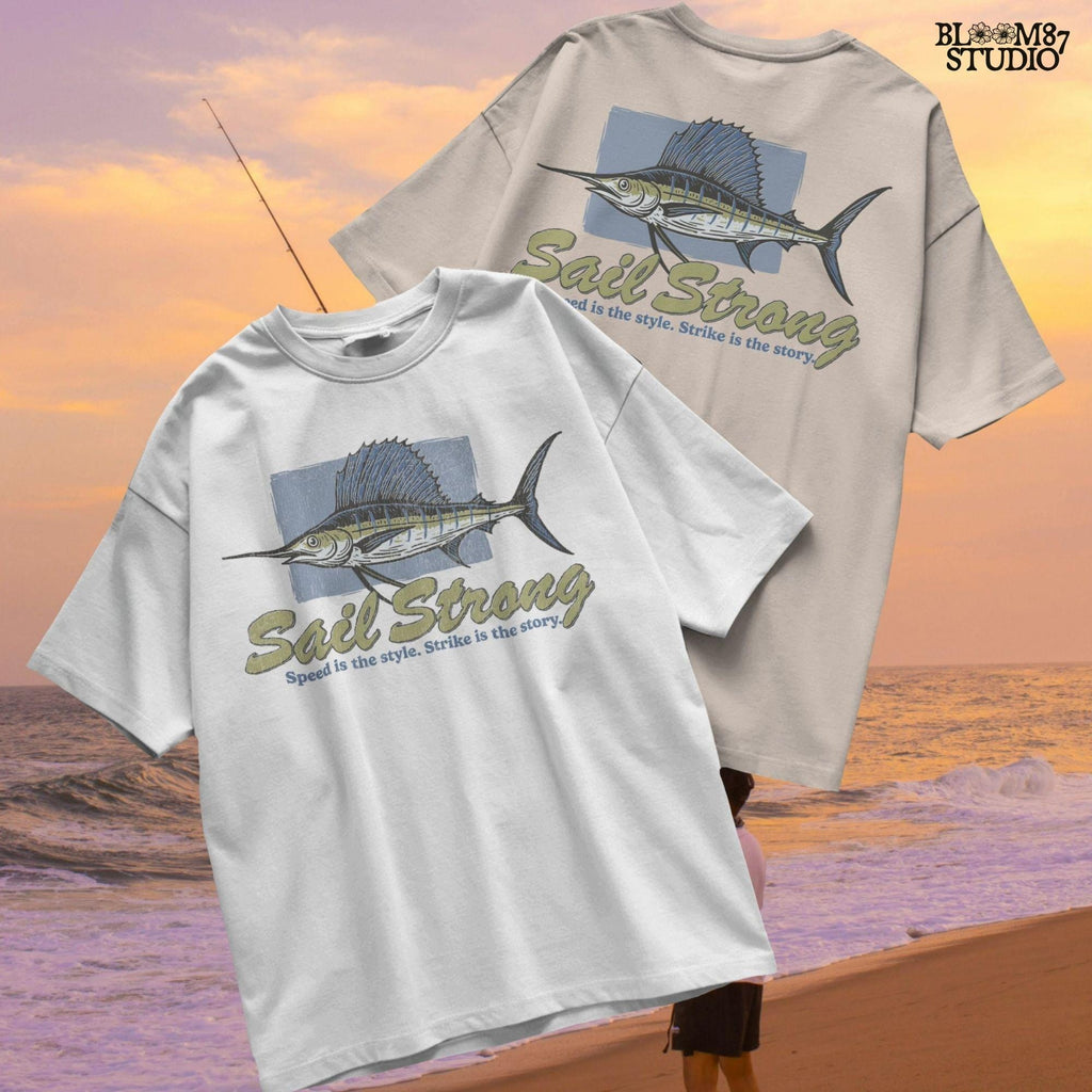 Illustrated sailfish with bold dorsal fin and text “Sail Strong – Speed is the style. Strike is the story” in nautical, vintage style.