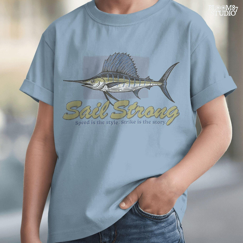 Illustrated sailfish with bold dorsal fin and text “Sail Strong – Speed is the style. Strike is the story” in nautical, vintage style.