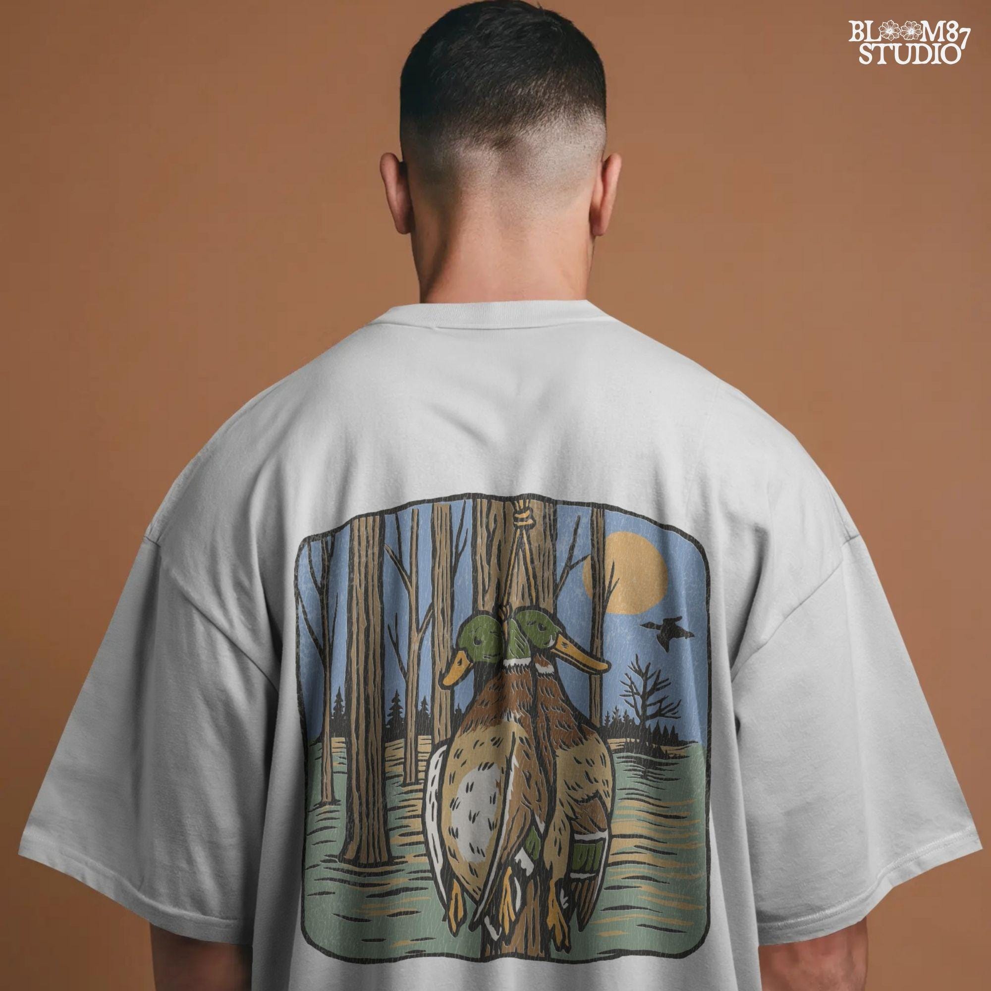 Illustration of two mallard ducks hanging from a tree in a flooded timber swamp at sunset, designed for duck hunting-themed sublimation and lodge decor.