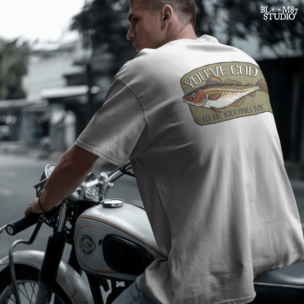 Hand-drawn Atlantic cod with the pun text “You’ve Cod to Be Kidding Me,” designed for funny fishing sublimation and dad joke gifts.