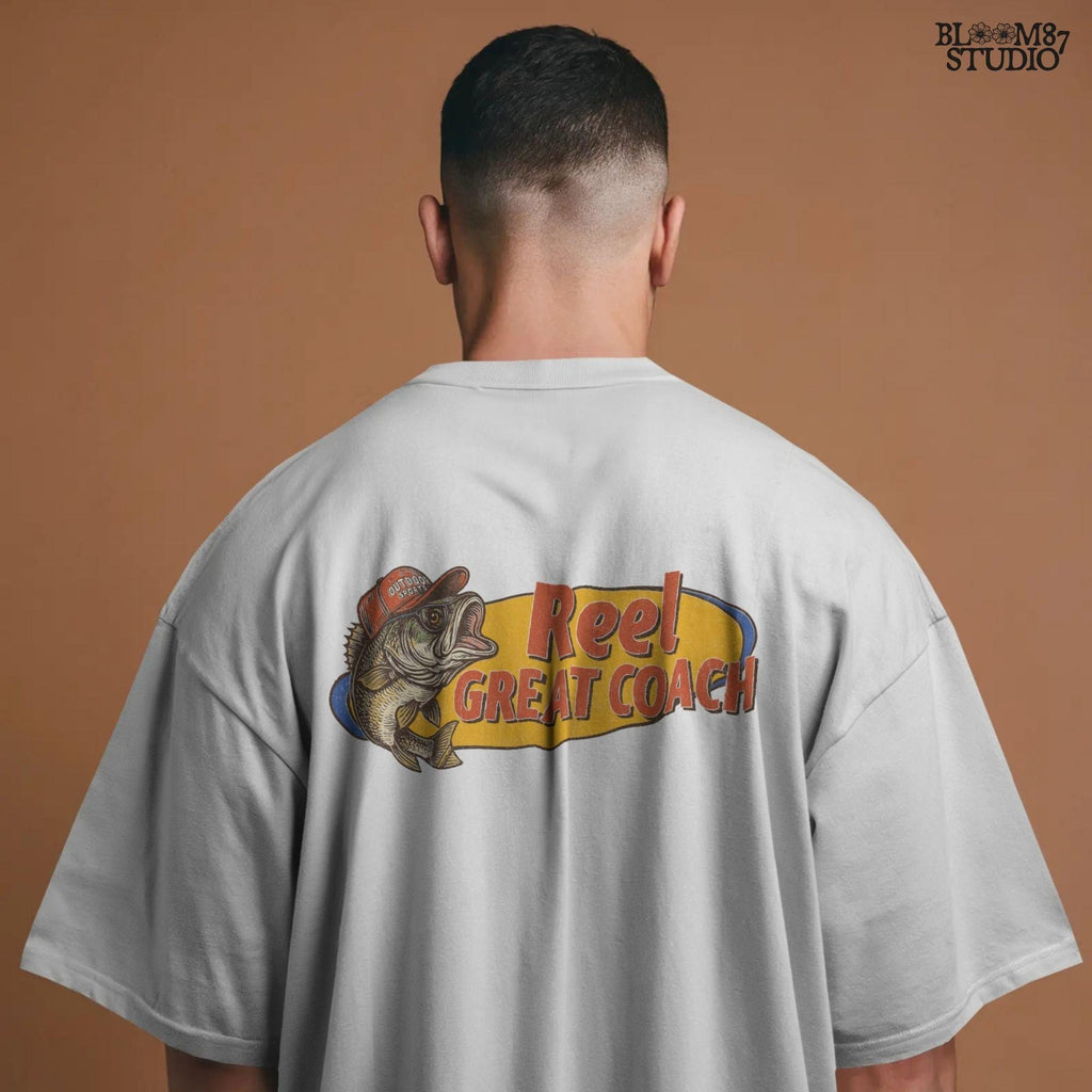 Vintage illustration of a largemouth bass wearing a red outdoor cap with the phrase “Reel Great Coach” in bold orange and yellow lettering, designed for sublimation on gifts and shirts.