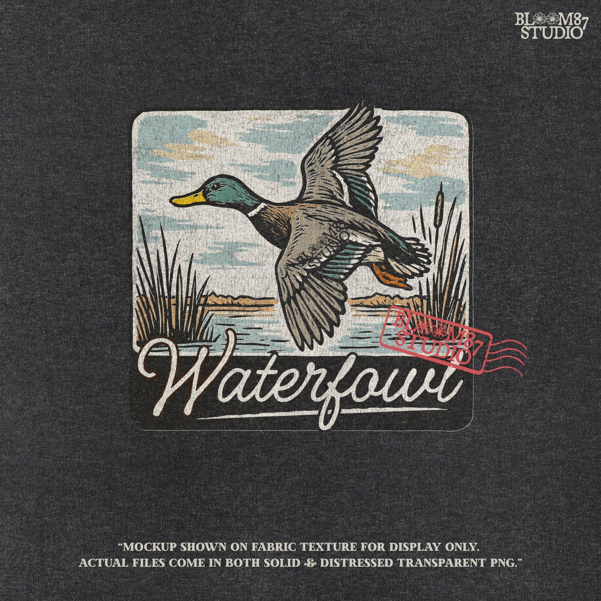 Vintage-style illustration of a flying mallard duck over a marsh with the word “Waterfowl” in script, perfect for duck hunting and outdoor-themed designs.