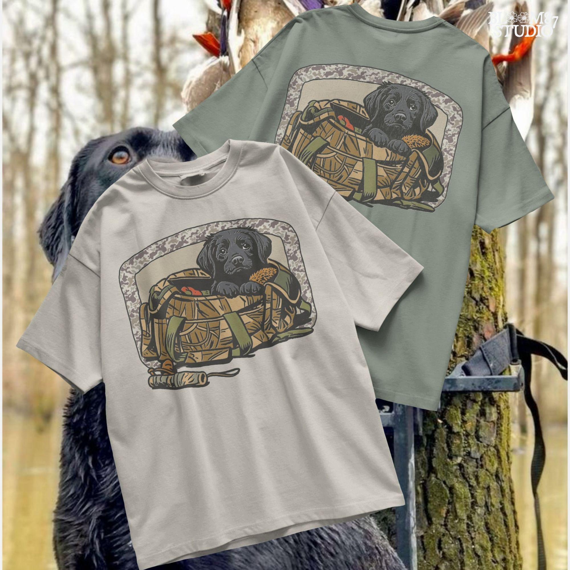 Black Labrador puppy in a camo hunting bag, framed in camouflage pattern, ideal for waterfowl and duck hunting sublimation art.