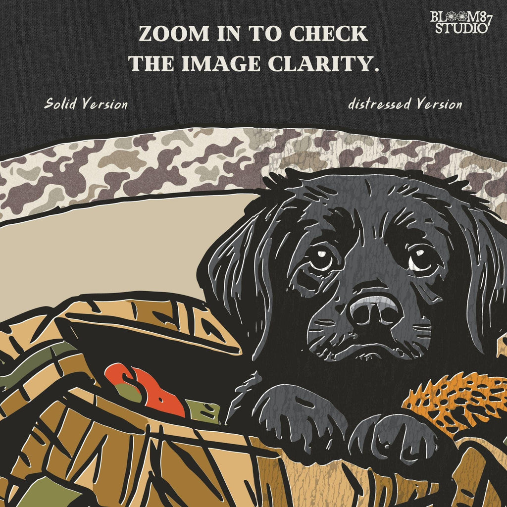 Black Labrador puppy in a camo hunting bag, framed in camouflage pattern, ideal for waterfowl and duck hunting sublimation art.