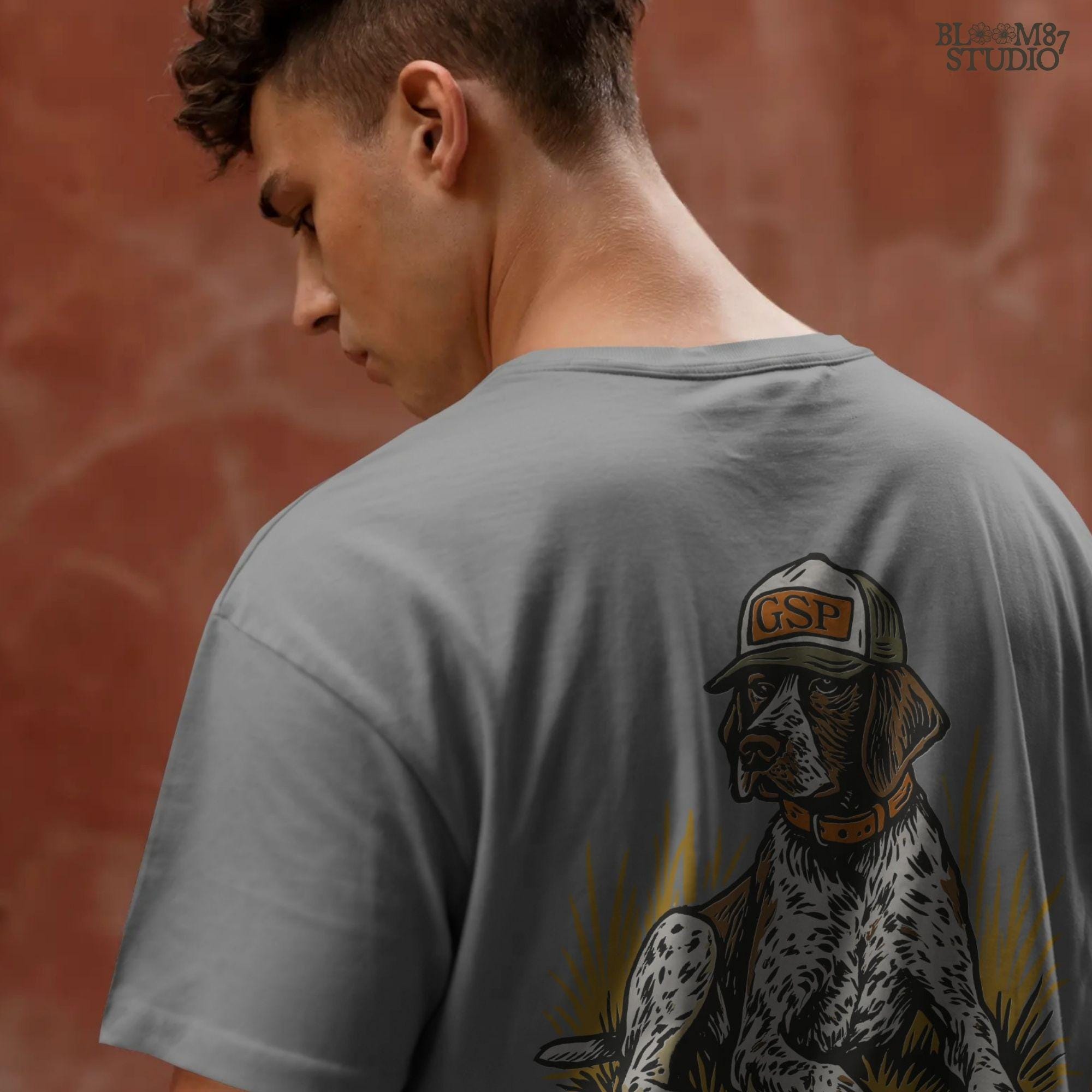 Illustration of a German Shorthaired Pointer dog wearing a GSP hat and orange collar, sitting in golden grass, perfect for hunting or fall-themed sublimation.