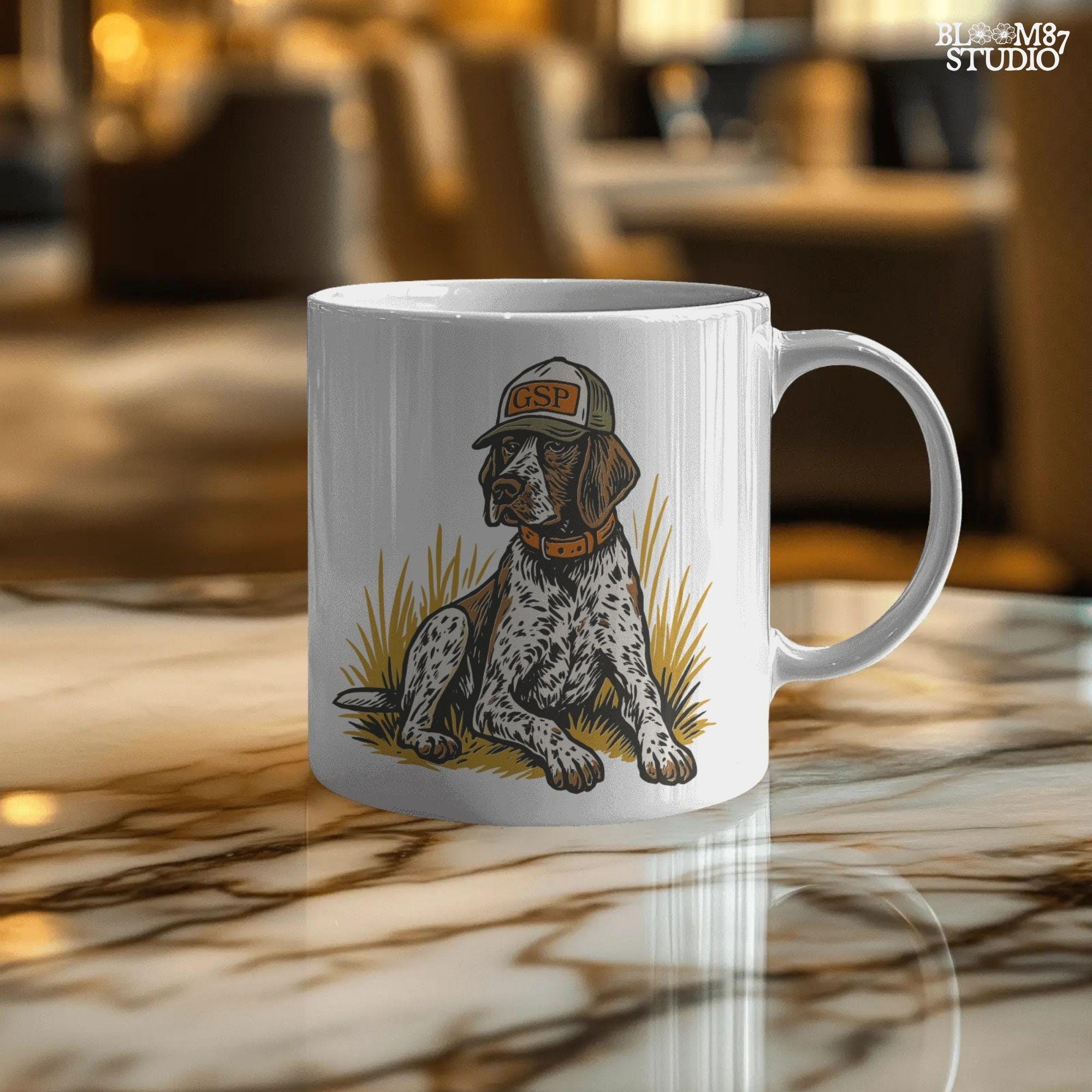 Illustration of a German Shorthaired Pointer dog wearing a GSP hat and orange collar, sitting in golden grass, perfect for hunting or fall-themed sublimation.