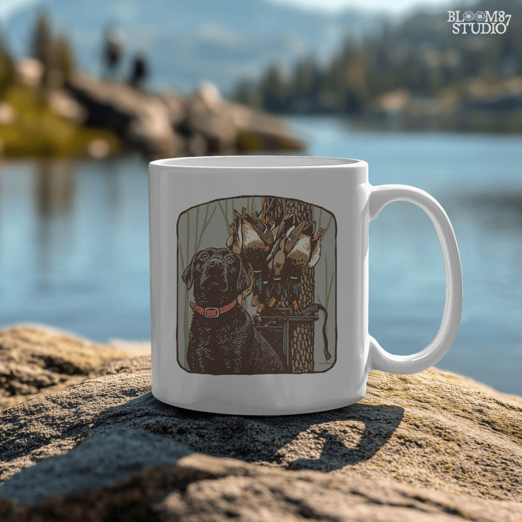 Digital PNG design of a black lab hunting dog with mallard ducks on a strap, ideal for sublimation printing on hunting-themed apparel