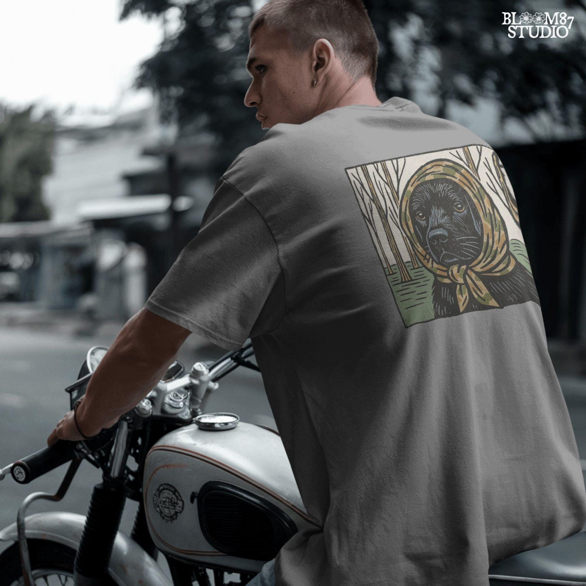 Digital PNG of a black labrador dog wearing a camo scarf in a forest setting, designed for hunting-themed sublimation printing