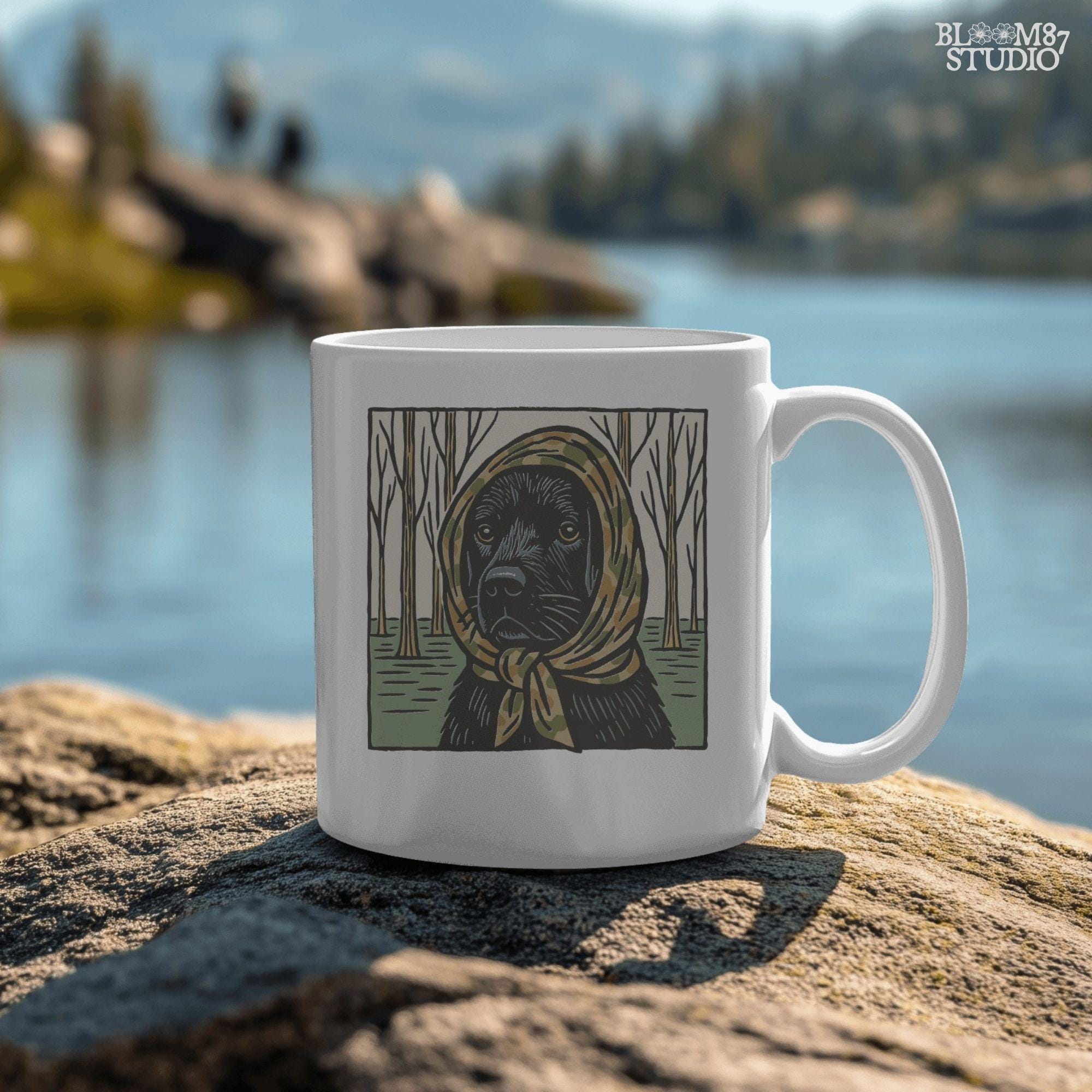 Digital PNG of a black labrador dog wearing a camo scarf in a forest setting, designed for hunting-themed sublimation printing