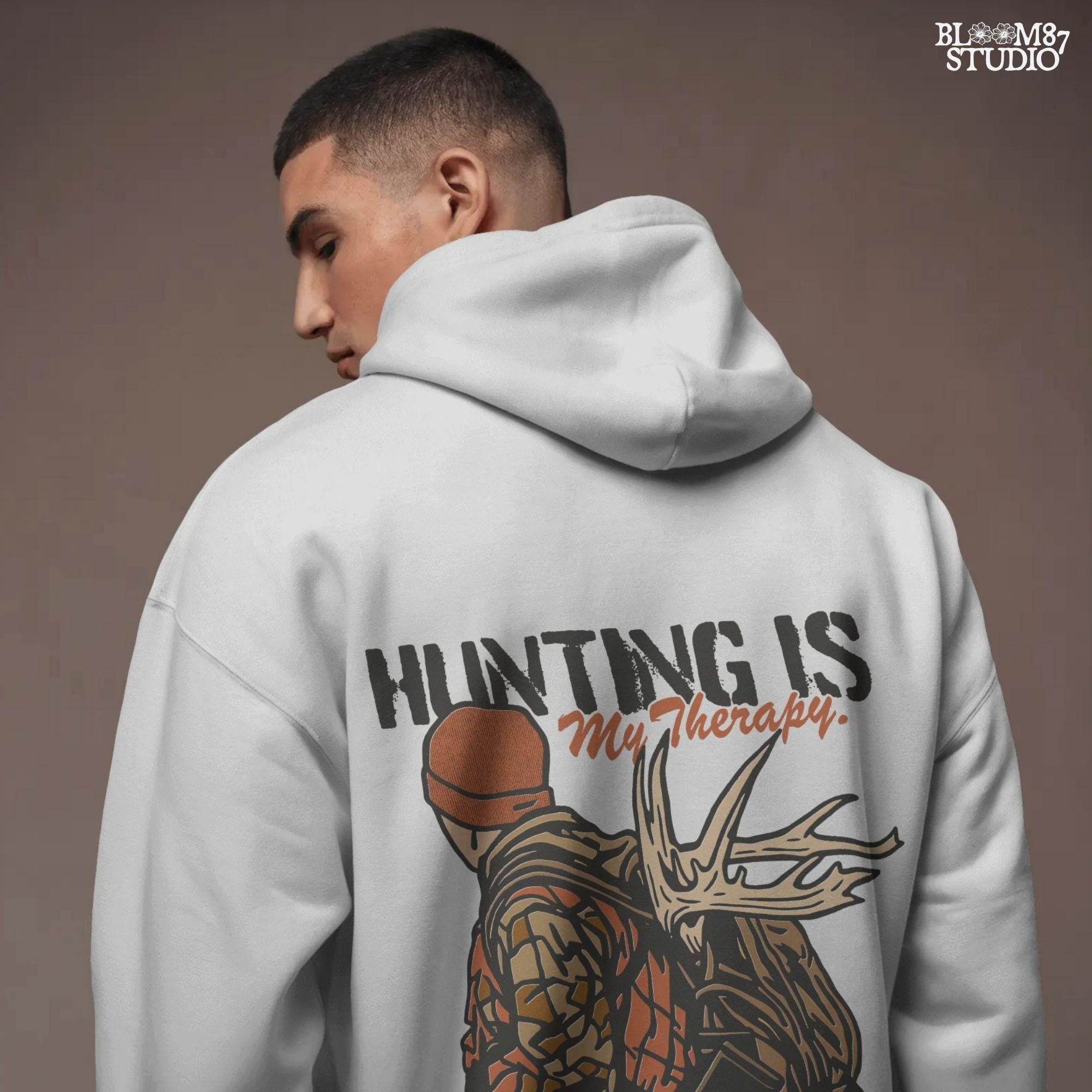 A camouflage hunter with antlers on backpack and text “Hunting Is My Therapy,” designed for fall hunting season sublimation and outdoor-themed apparel.