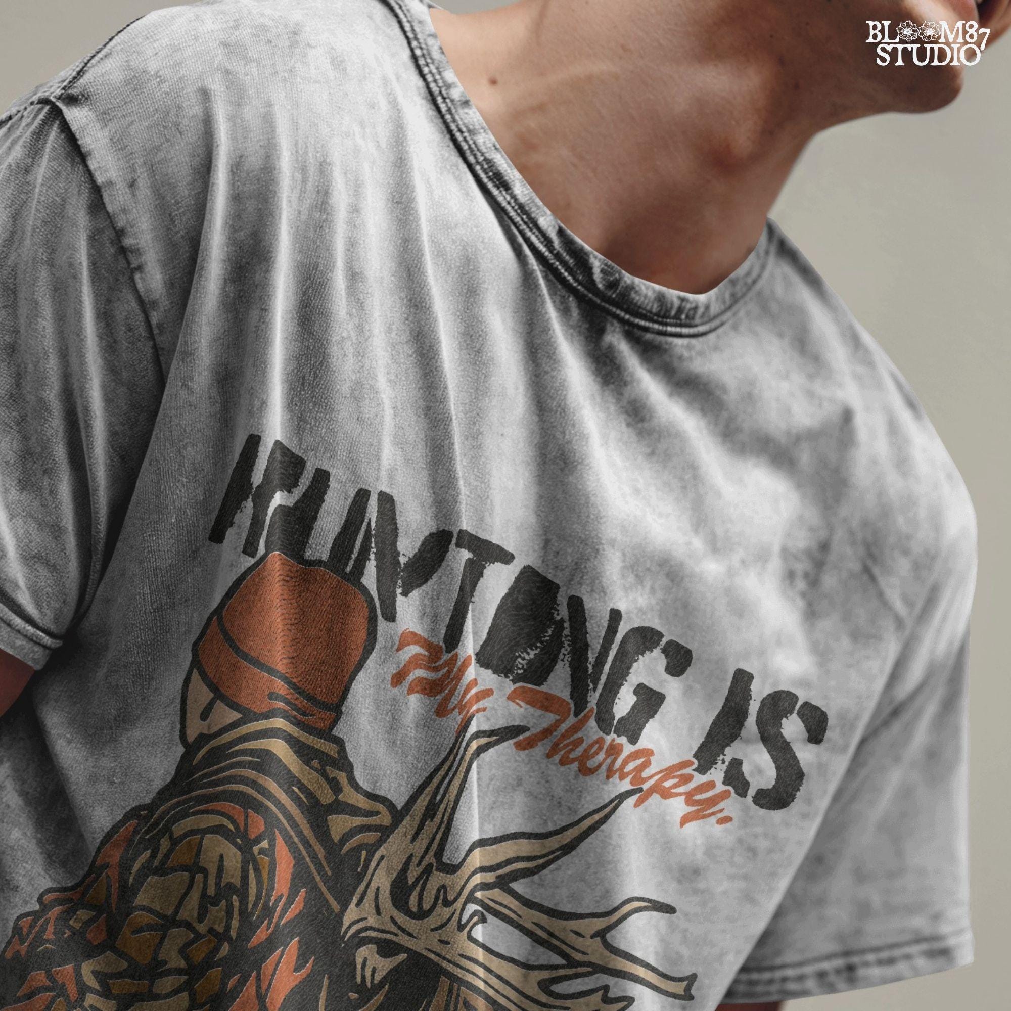 A camouflage hunter with antlers on backpack and text “Hunting Is My Therapy,” designed for fall hunting season sublimation and outdoor-themed apparel.