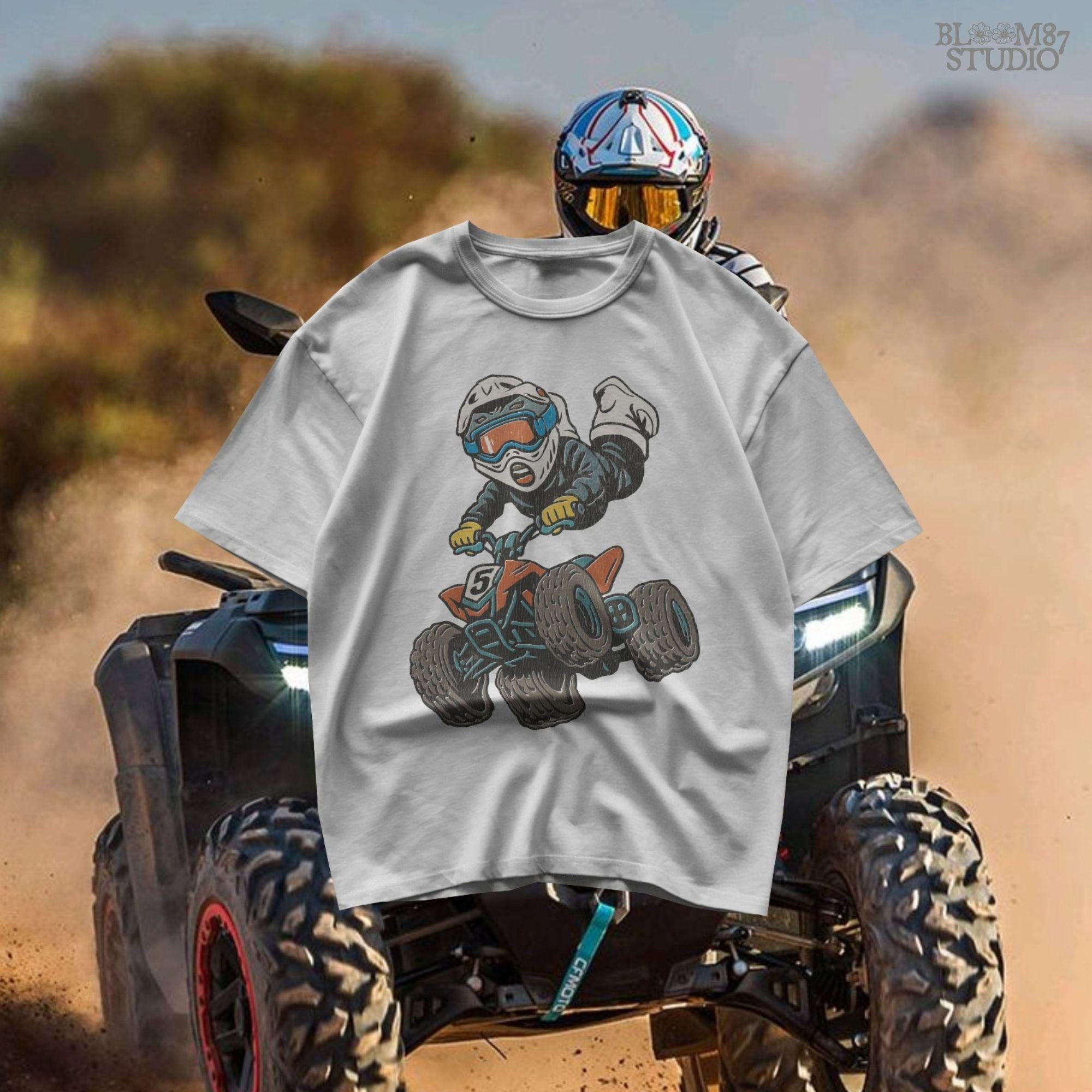 Digital PNG of a boy riding an ATV mid-jump wearing motocross gear and helmet, perfect for kids racing sublimation projects.