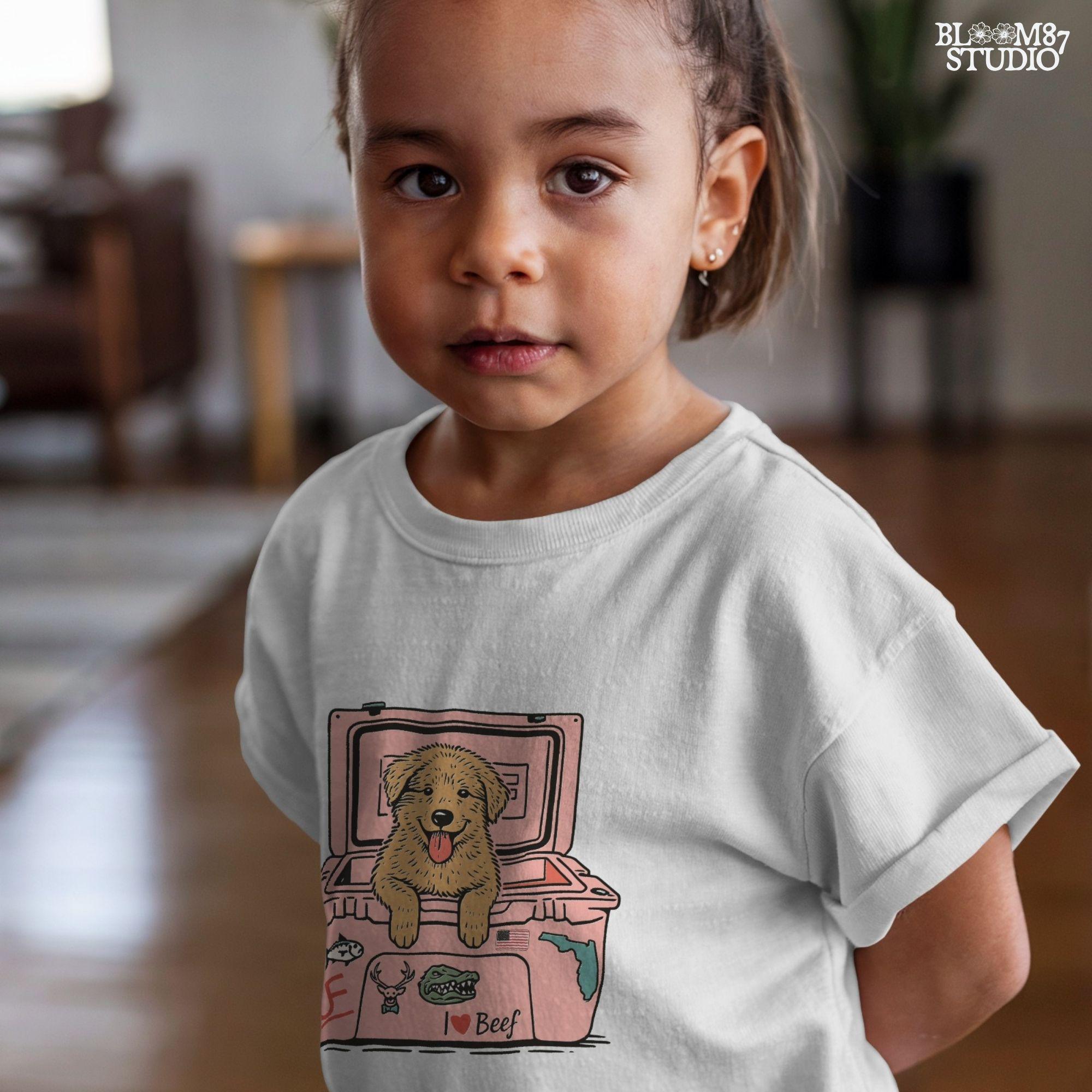 Golden retriever puppy with tongue out sitting inside a pink cooler decorated with Florida and beef stickers, sublimation design for dog lovers.