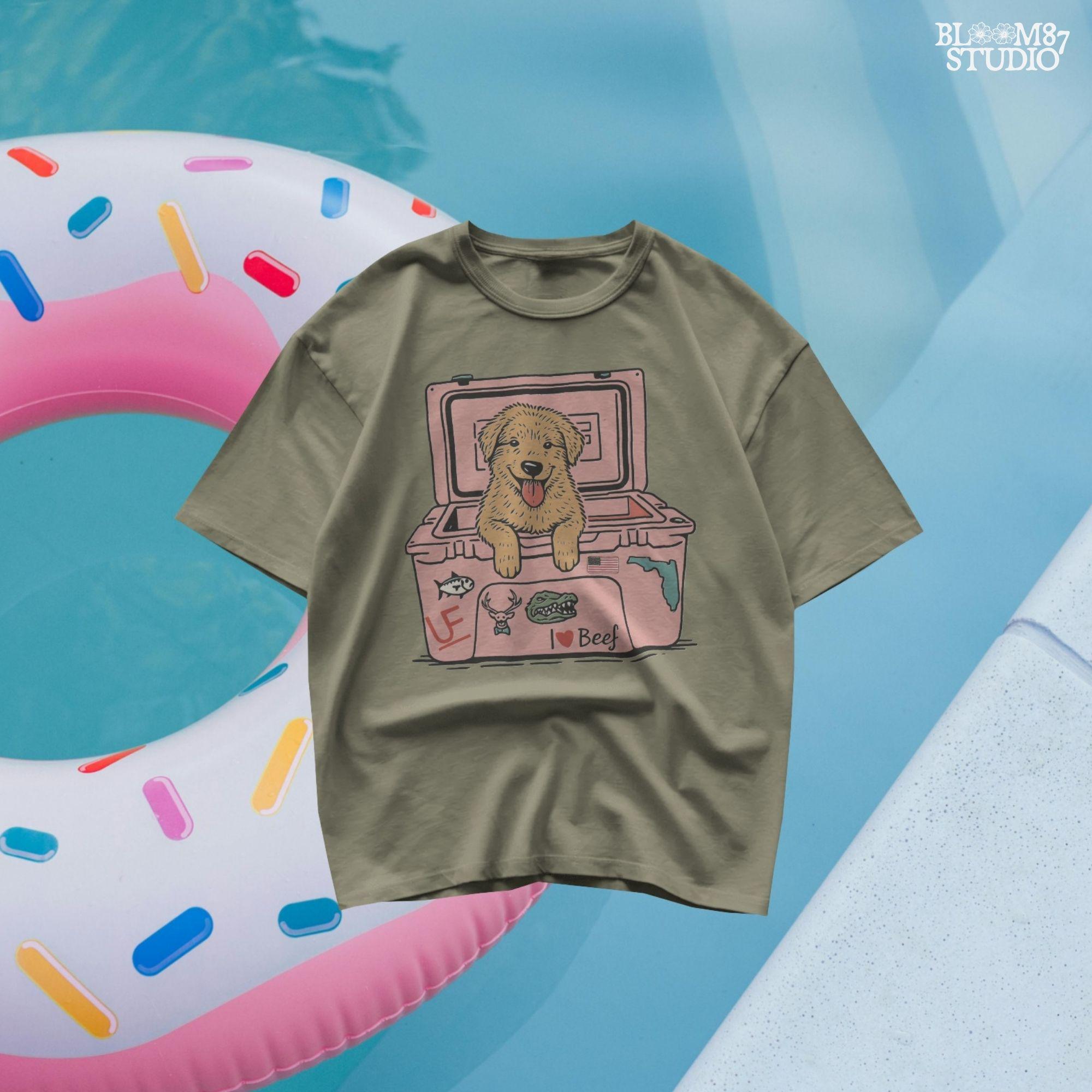 Golden retriever puppy with tongue out sitting inside a pink cooler decorated with Florida and beef stickers, sublimation design for dog lovers.