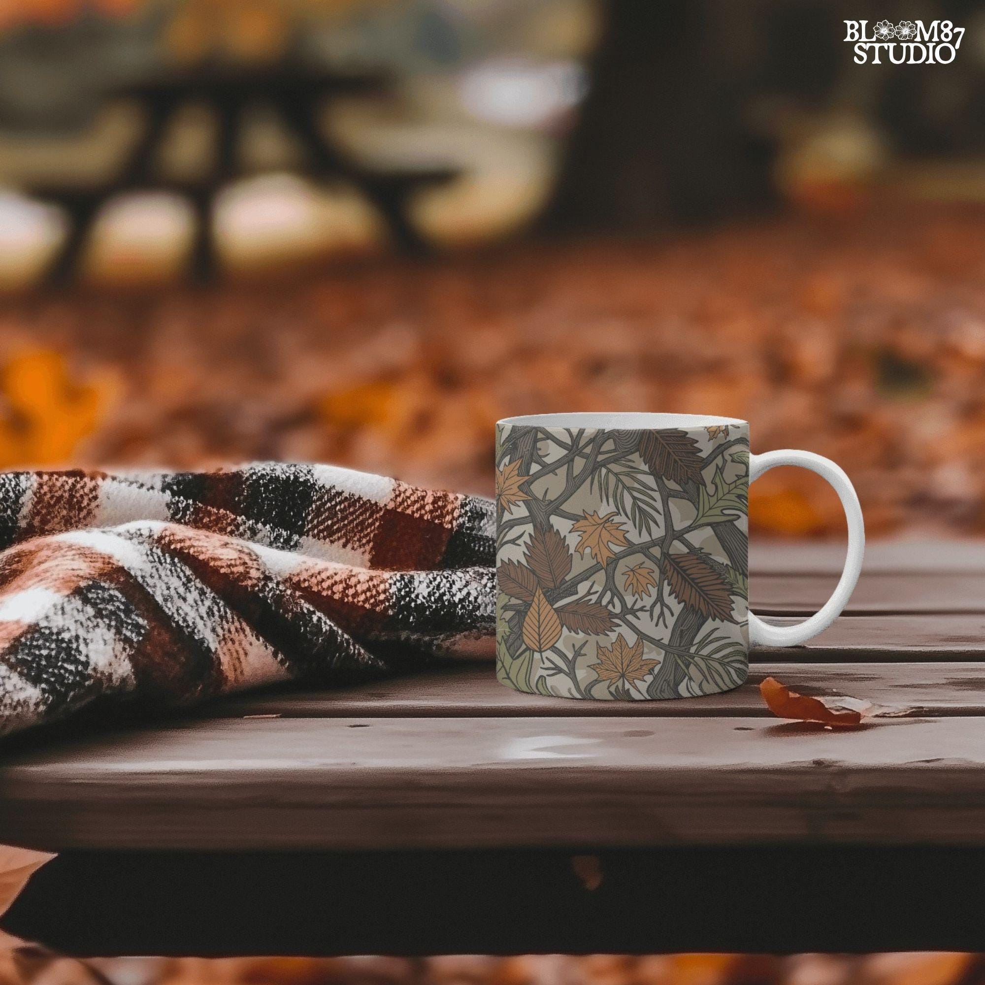 Seamless camouflage PNG pattern with autumn leaves, tree branches, and earthy tones of orange, brown, and green for fall sublimation use.