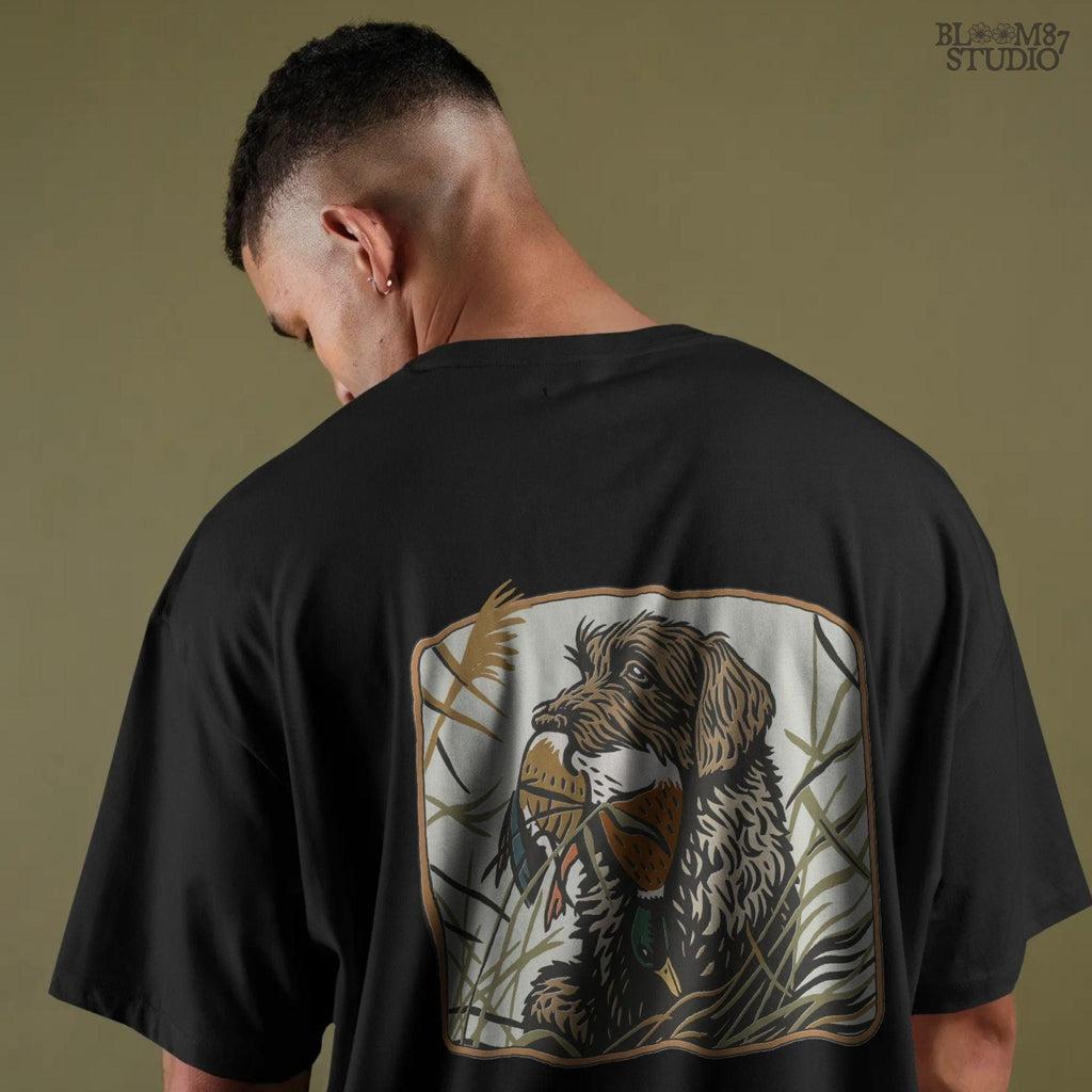 Wirehaired hunting dog holding a mallard duck in its mouth, surrounded by tall grass in a fall marsh scene, sublimation PNG for hunting-themed designs.