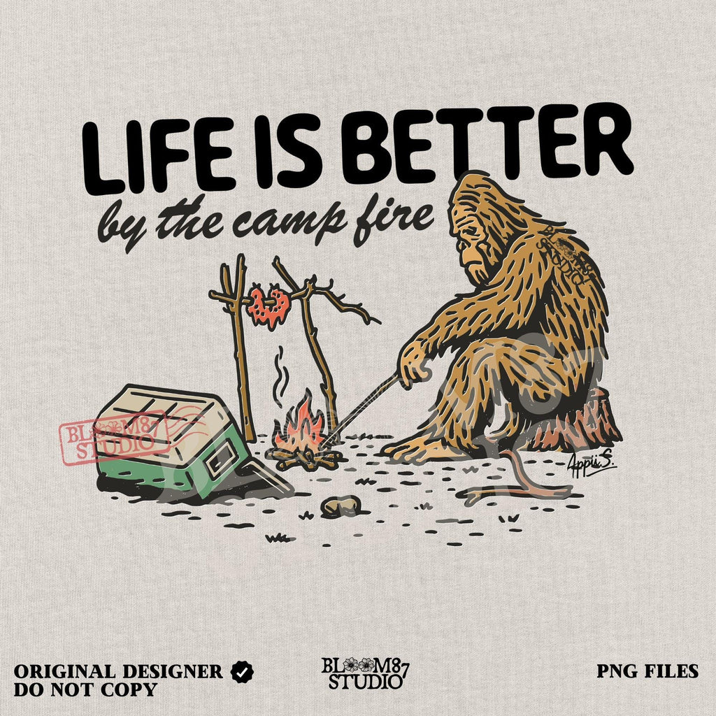 Bigfoot roasting meat over a campfire next to a tipped cooler, with the phrase “Life Is Better by the camp fire” above, illustrated PNG design for outdoor sublimation.
