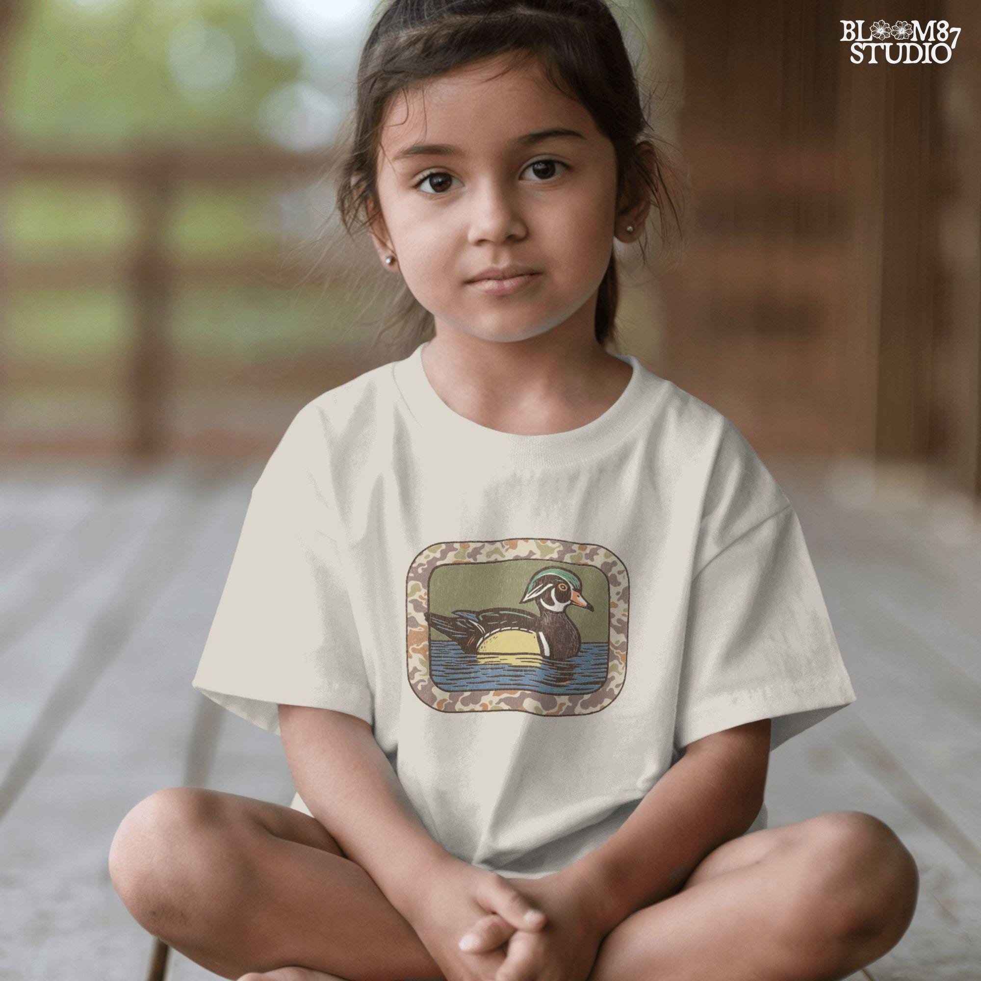 Rustic wood duck illustration with green, brown, and tan camo border; sublimation PNG for hunting or wildlife-themed crafts and apparel.