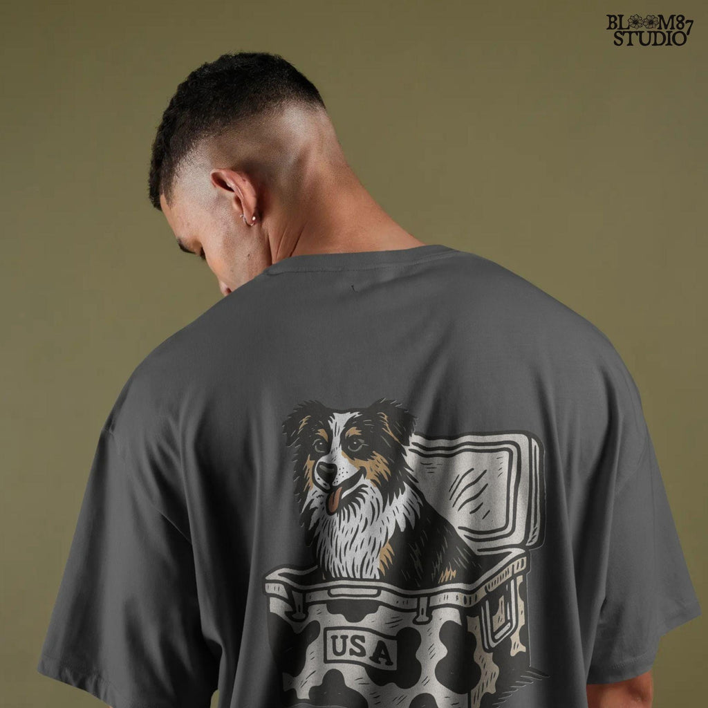 Illustration of an Australian Shepherd dog sitting inside a cowhide-pattern USA cooler; western patriotic sublimation PNG for dog lovers and crafters.