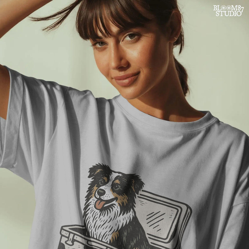 Illustration of an Australian Shepherd dog sitting inside a cowhide-pattern USA cooler; western patriotic sublimation PNG for dog lovers and crafters.