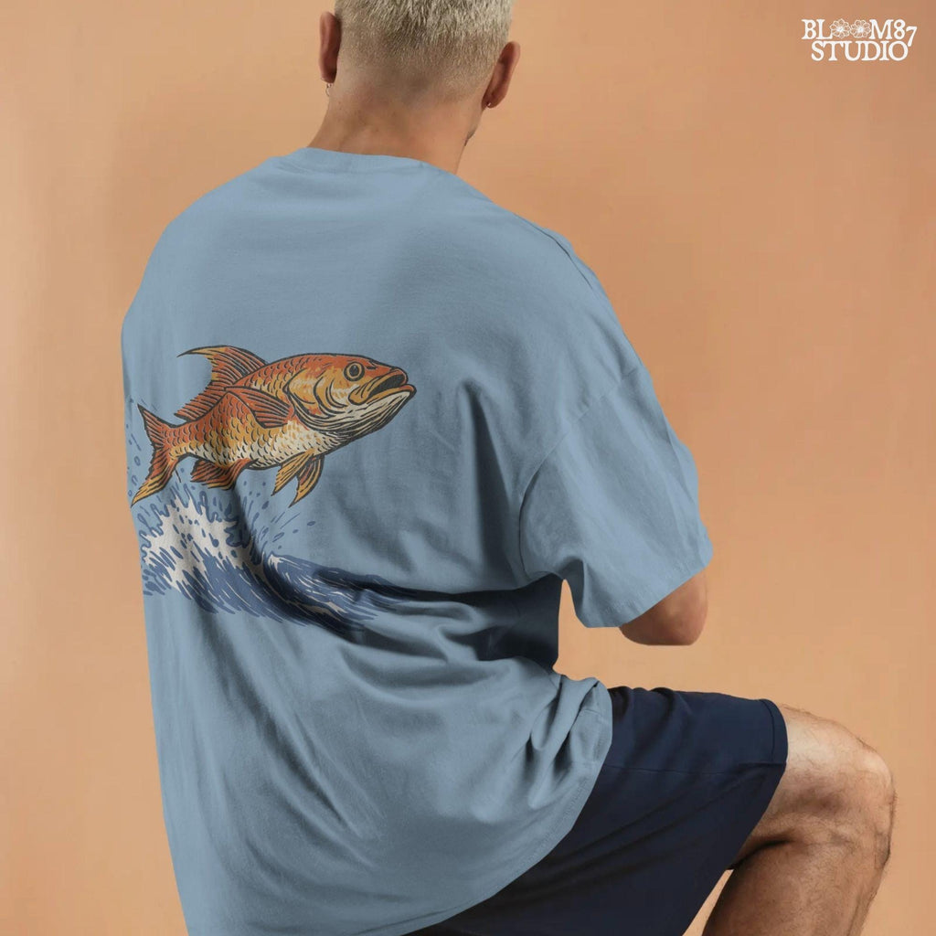 Redfish jumping from the ocean with large splash, illustrated in bold vintage style with orange scales and dramatic water movement.