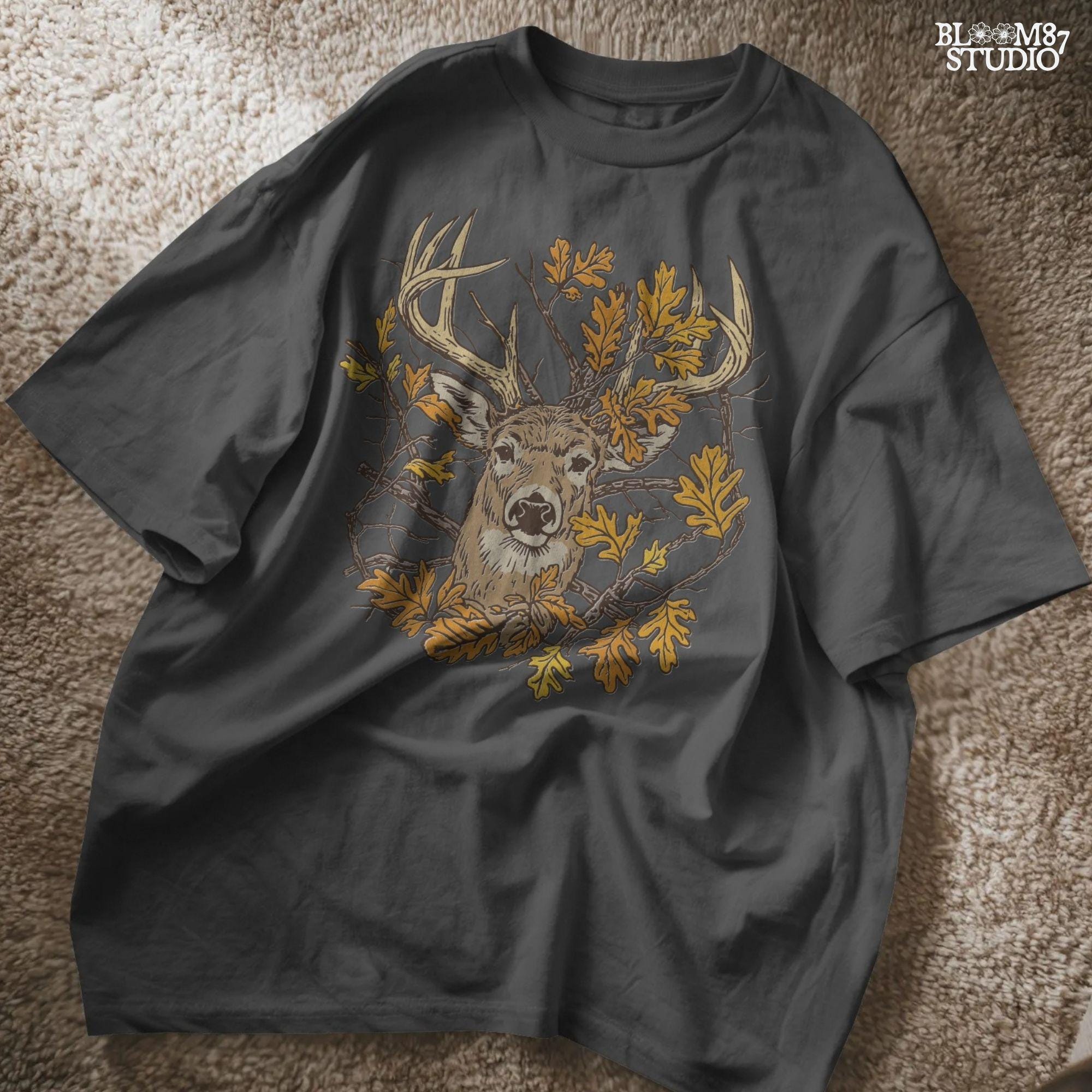Illustration of a whitetail deer head with large antlers surrounded by golden autumn oak leaves and forest branches, rustic fall theme.