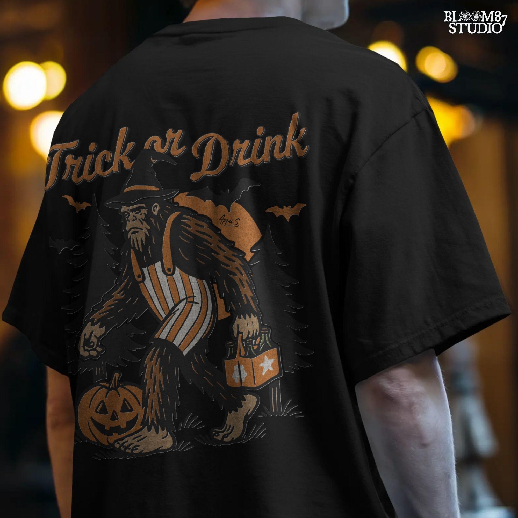 Funny Halloween bigfoot holding beer in witch hat and striped overalls, walking past pumpkins and trees with “Trick or Drink” text above.