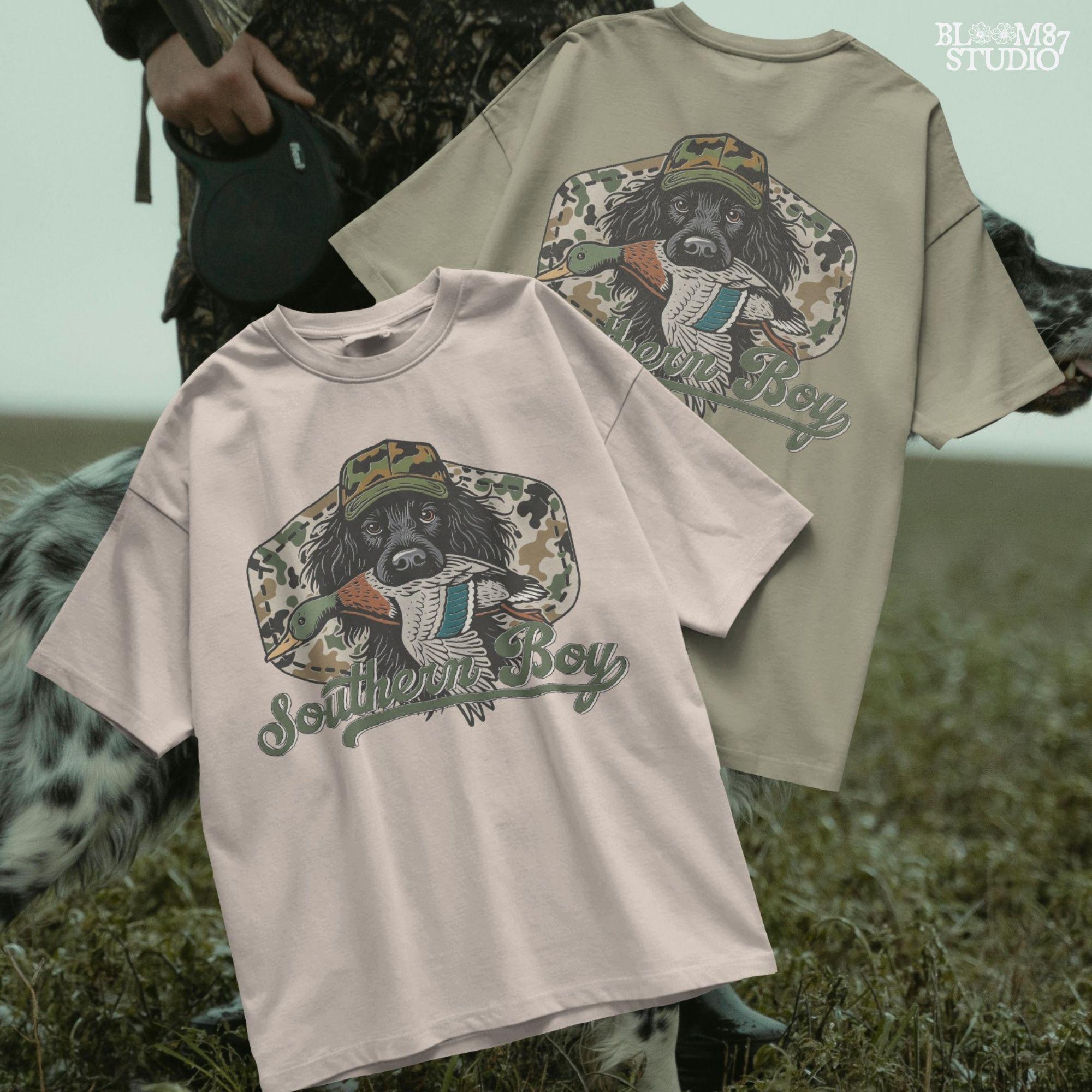 Illustration of a black hunting dog wearing a camo hat, holding a mallard duck in its mouth with the text “Southern Boy” below, in a rustic Southern style.