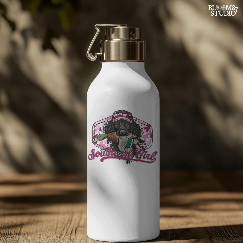 Illustration of a black hunting dog wearing a pink camo hat and holding a mallard duck, with “Southern Girl” text and pink camouflage background.
