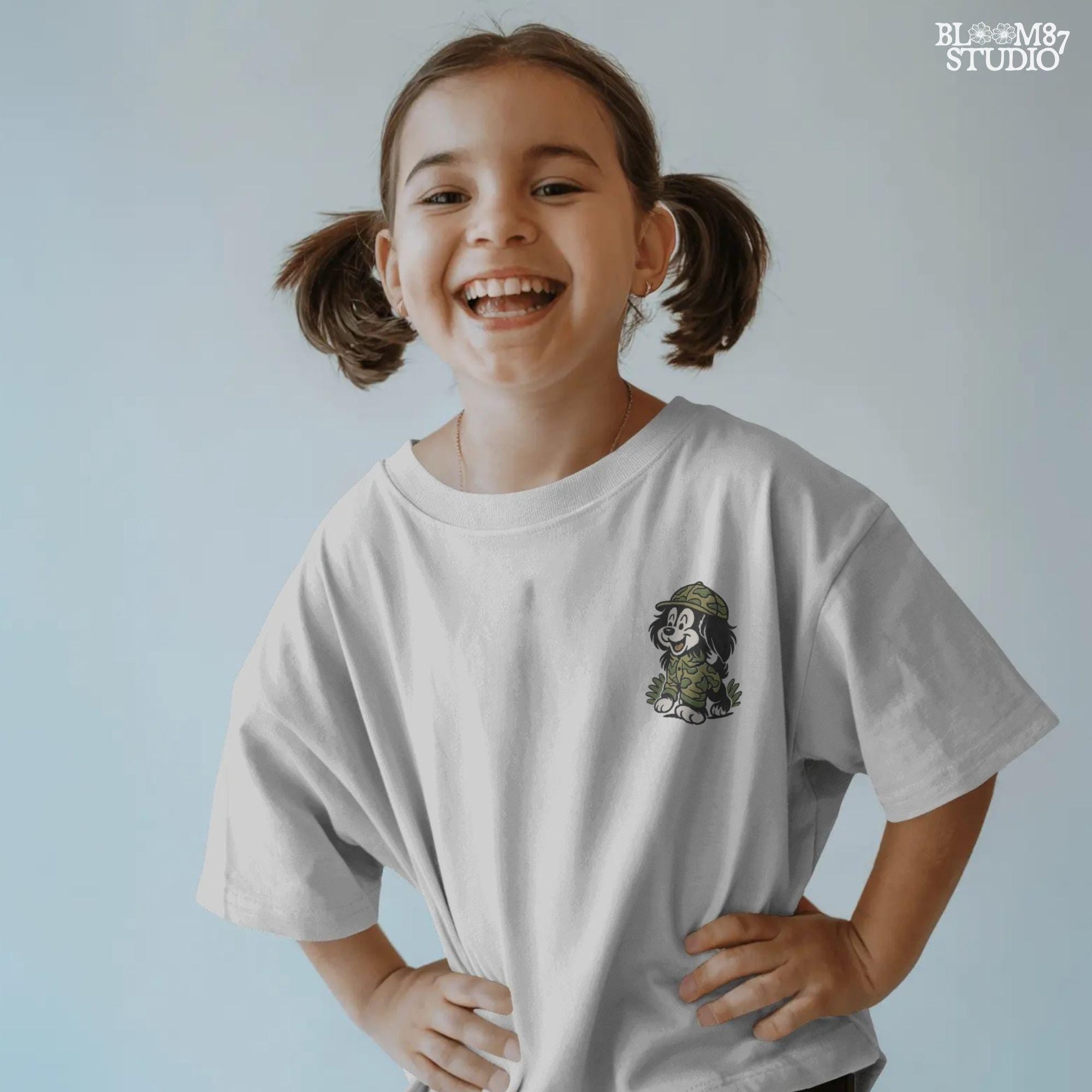 Cartoon hunting dog in camo outfit (front design) and back scene with ducks and the same dog with “Duck Duck Woof!” text – cute front and back PNG set for kids.