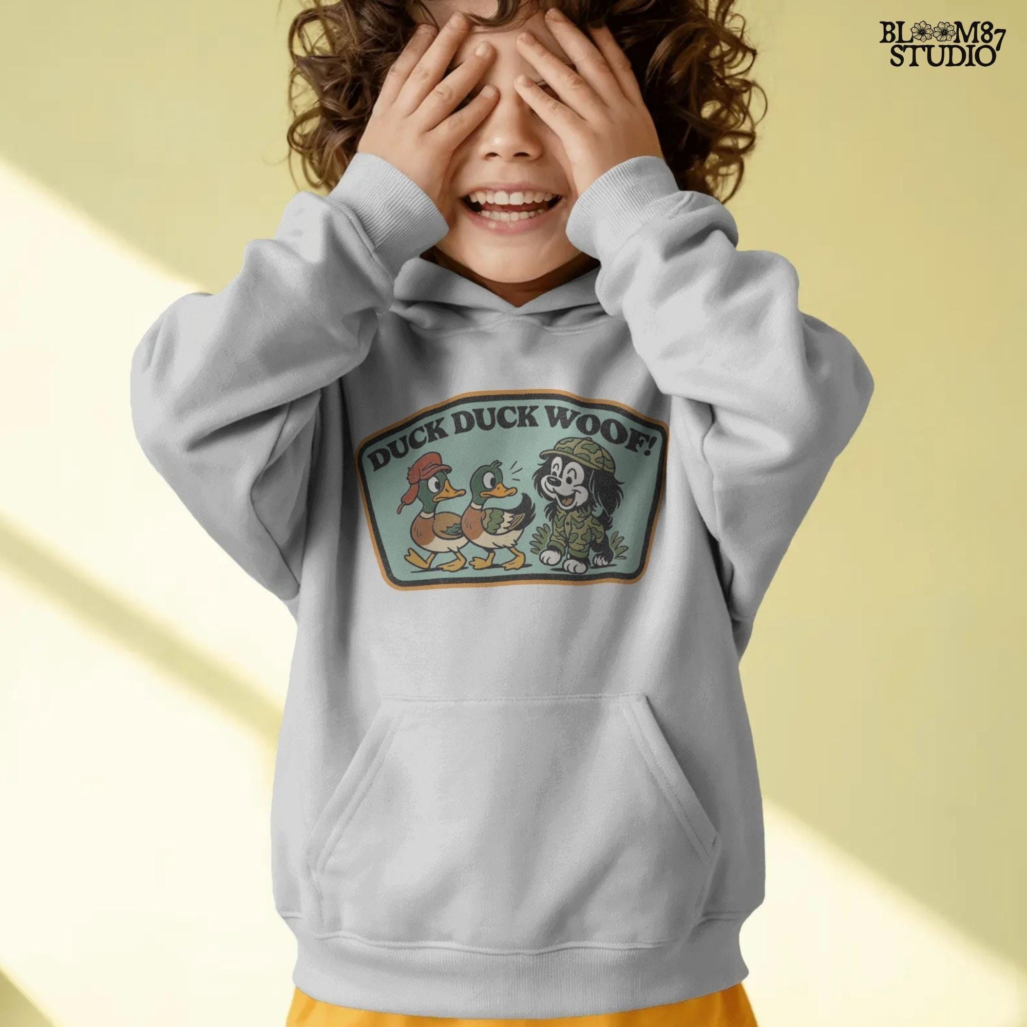 Cartoon hunting dog in camo outfit (front design) and back scene with ducks and the same dog with “Duck Duck Woof!” text – cute front and back PNG set for kids.