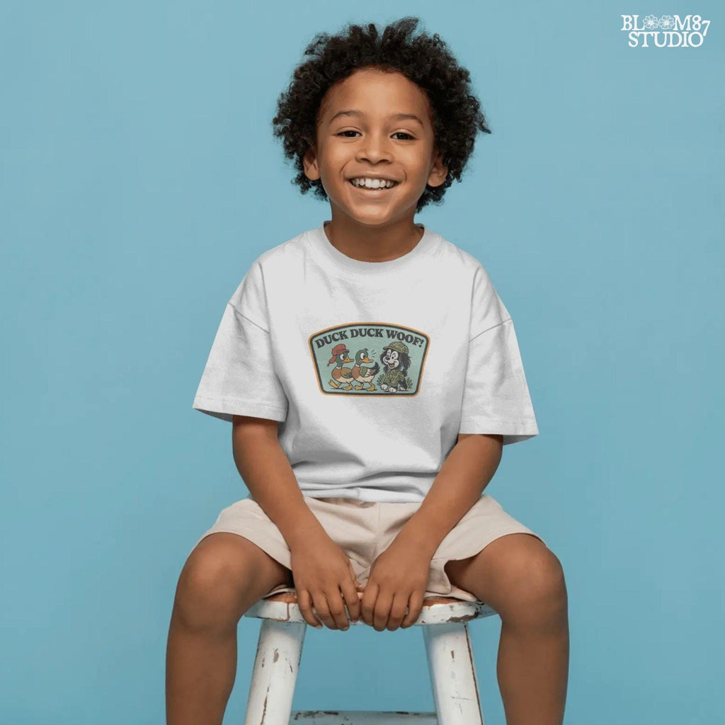 Cartoon hunting dog in camo outfit (front design) and back scene with ducks and the same dog with “Duck Duck Woof!” text – cute front and back PNG set for kids.