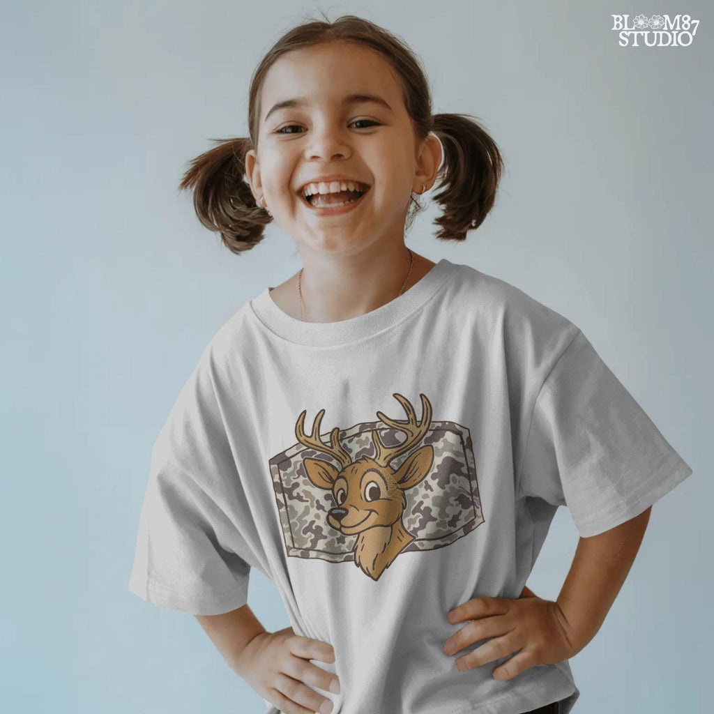 Cartoon deer with big antlers in front of a camouflage background – sublimation PNG design for fall, back to school, or kids’ hunting season shirts.