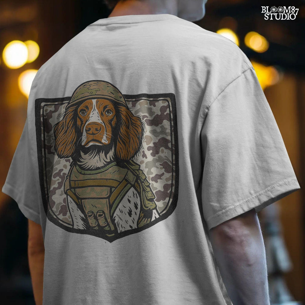 Illustration of a military hunting dog in camo vest and helmet, standing in front of a camouflage shield background, PNG for sublimation use