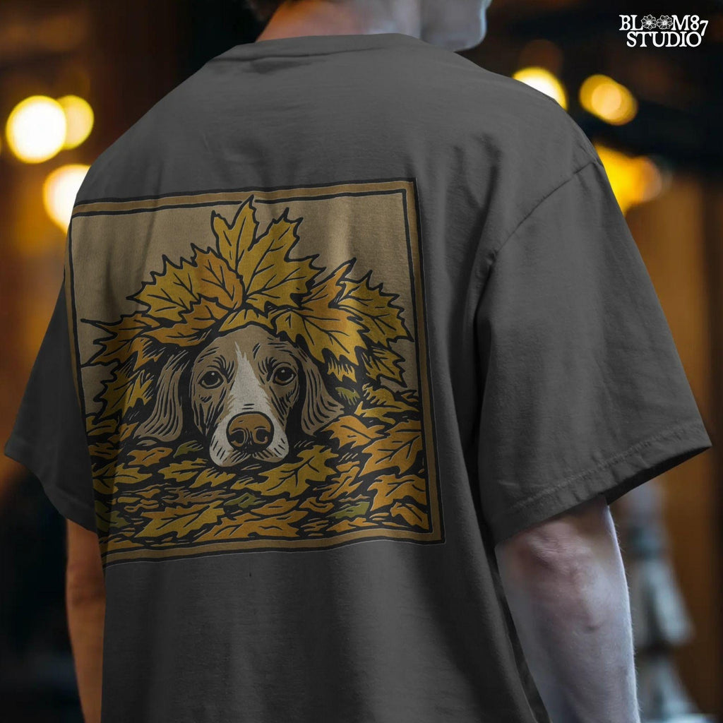 Hunting dog peeking through a pile of golden autumn leaves, rustic fall-themed illustration for seasonal sublimation design use
