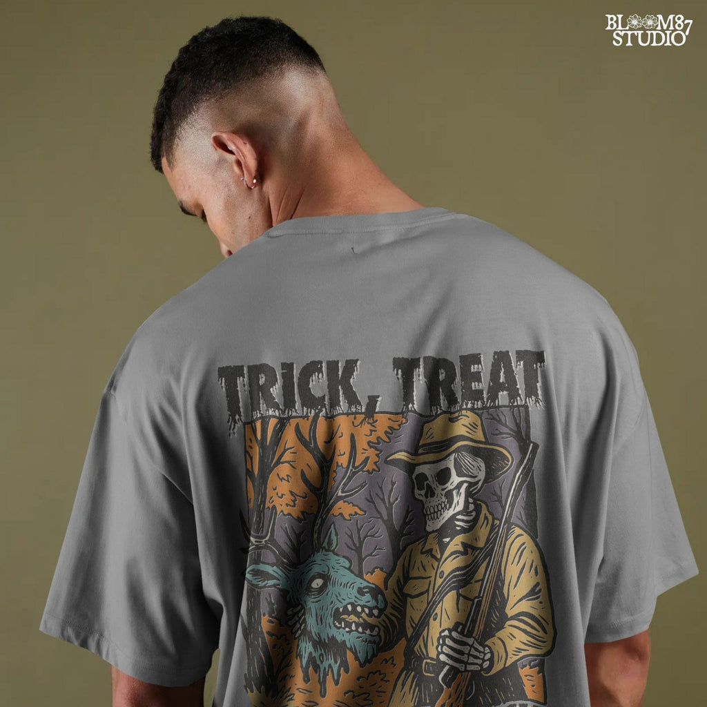 Vintage-style Halloween illustration of a skeleton hunter holding a severed zombie deer head with the phrase “Trick, Treat and Trophy Bucks,” in spooky forest setting.