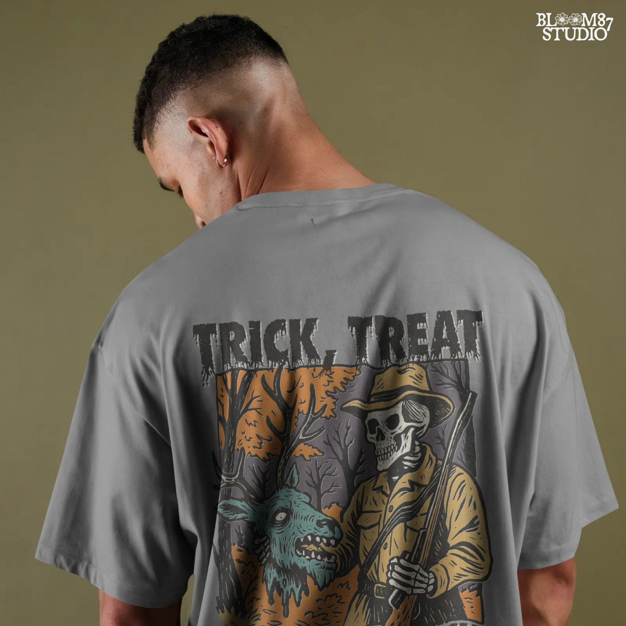 Vintage-style Halloween illustration of a skeleton hunter holding a severed zombie deer head with the phrase “Trick, Treat and Trophy Bucks,” in spooky forest setting.