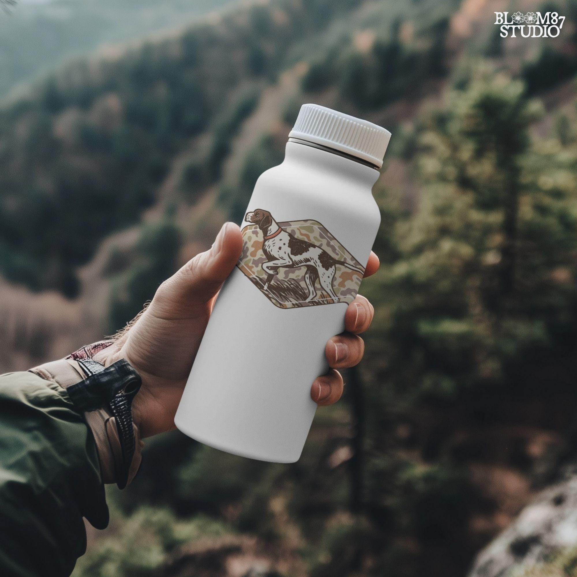 Brown and white hunting pointer dog in a standing pose over a woodland camo background, perfect for fall or Thanksgiving-themed sublimation designs.