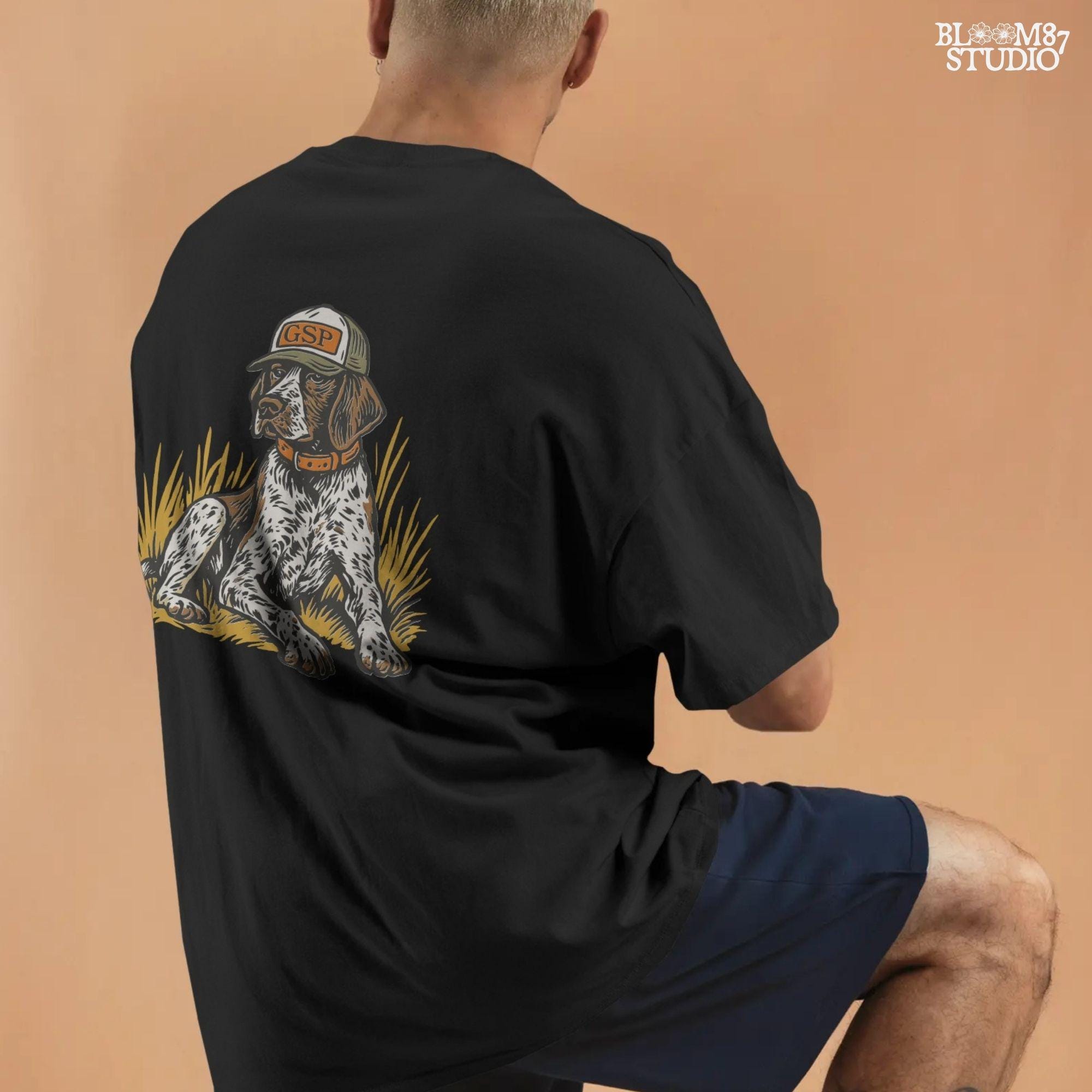 Illustration of a German Shorthaired Pointer dog wearing a GSP hat and orange collar, sitting in golden grass, perfect for hunting or fall-themed sublimation.