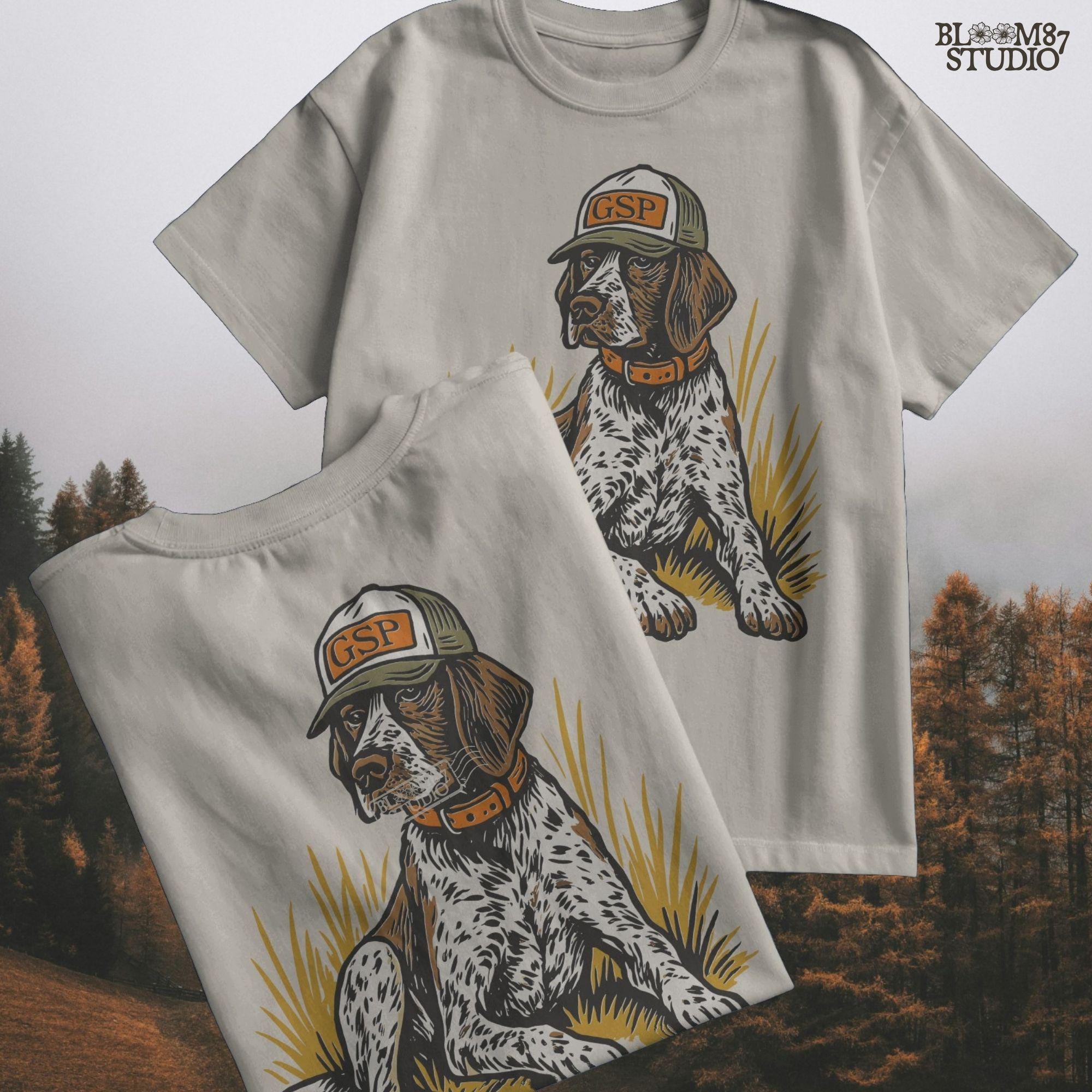 Illustration of a German Shorthaired Pointer dog wearing a GSP hat and orange collar, sitting in golden grass, perfect for hunting or fall-themed sublimation.